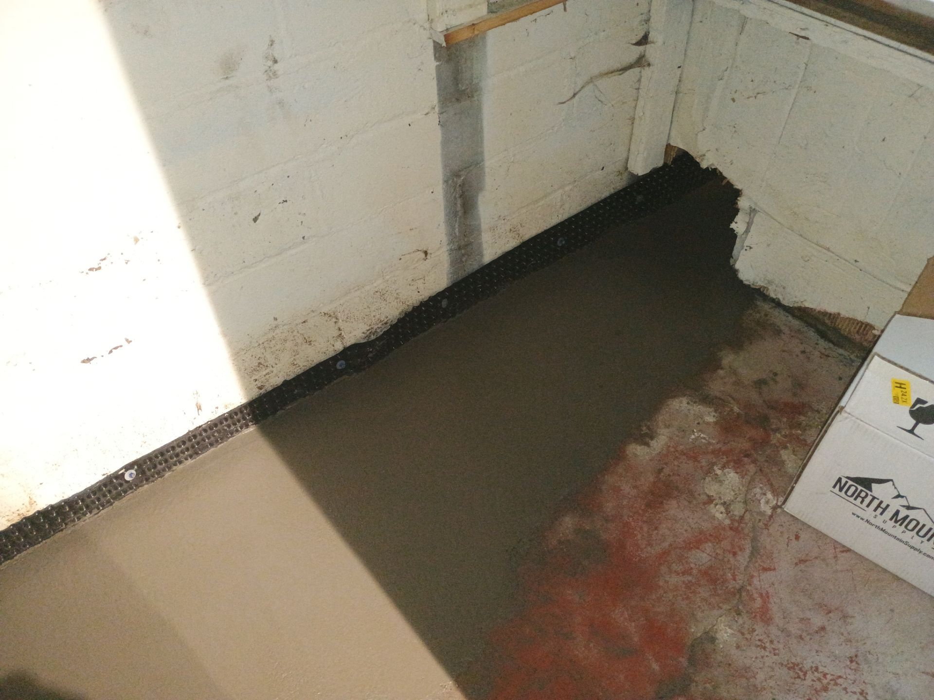 Interior Drain Tile & Sump Pump System in North Minneapolis by Waterproofing Northeast