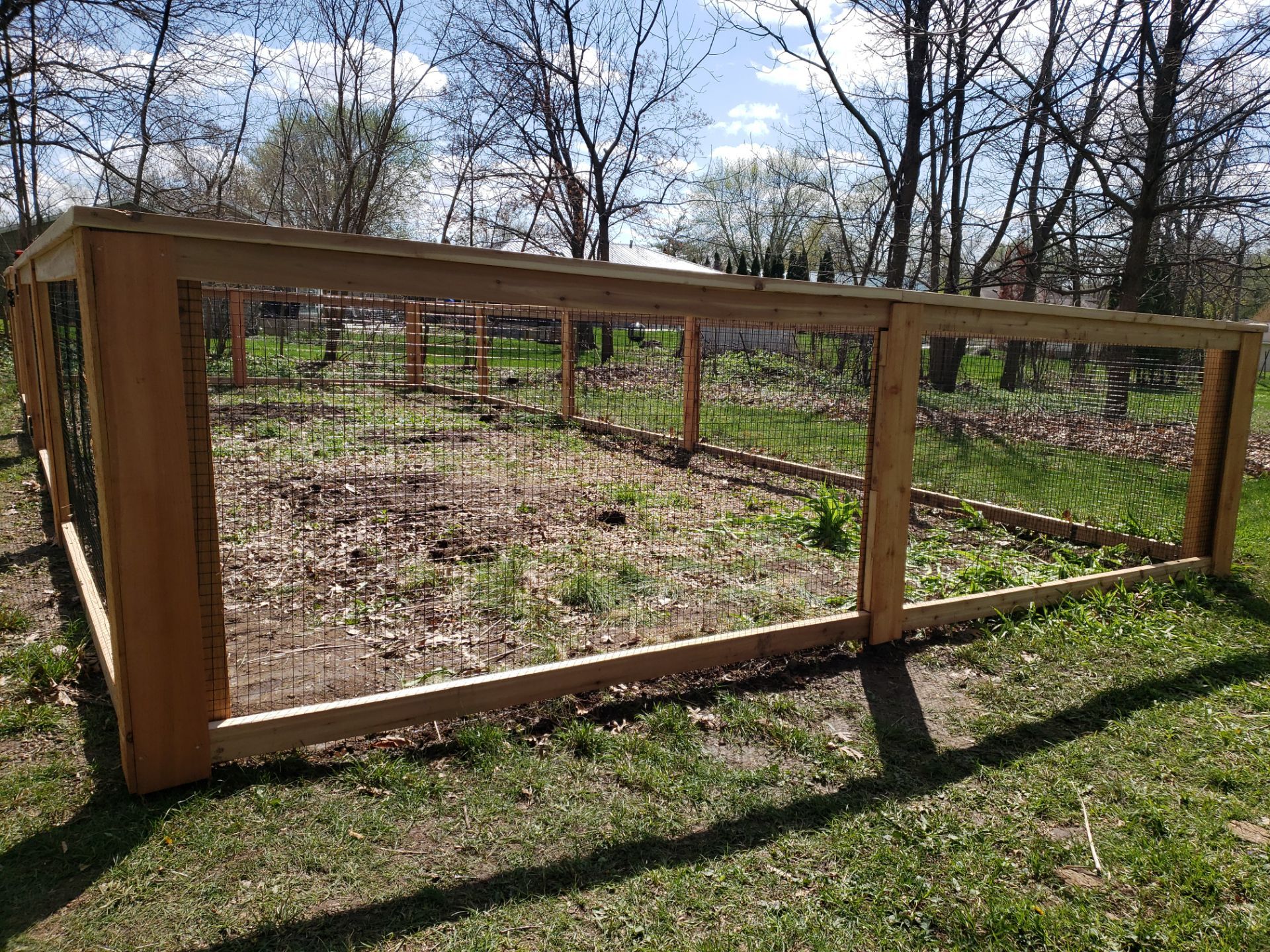Custom Cedar Wood Garden Fence Installation in Cedar Falls by Perfect Picket Fence and Stain