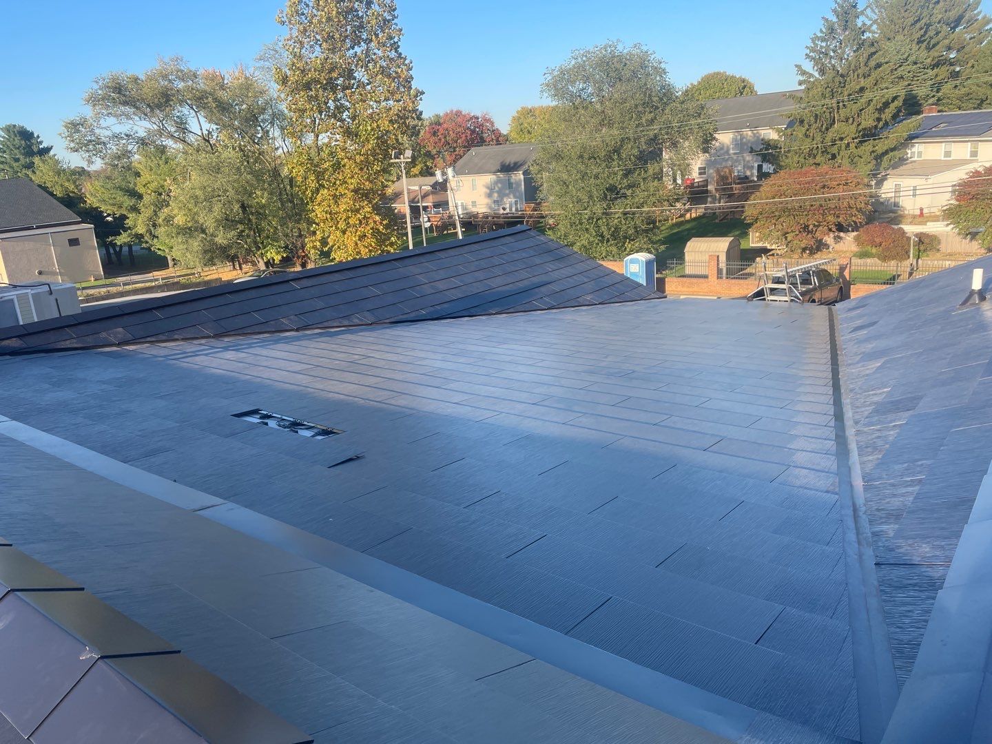 Tesla Solar Roof on a Commercial Building by American Home Contractors