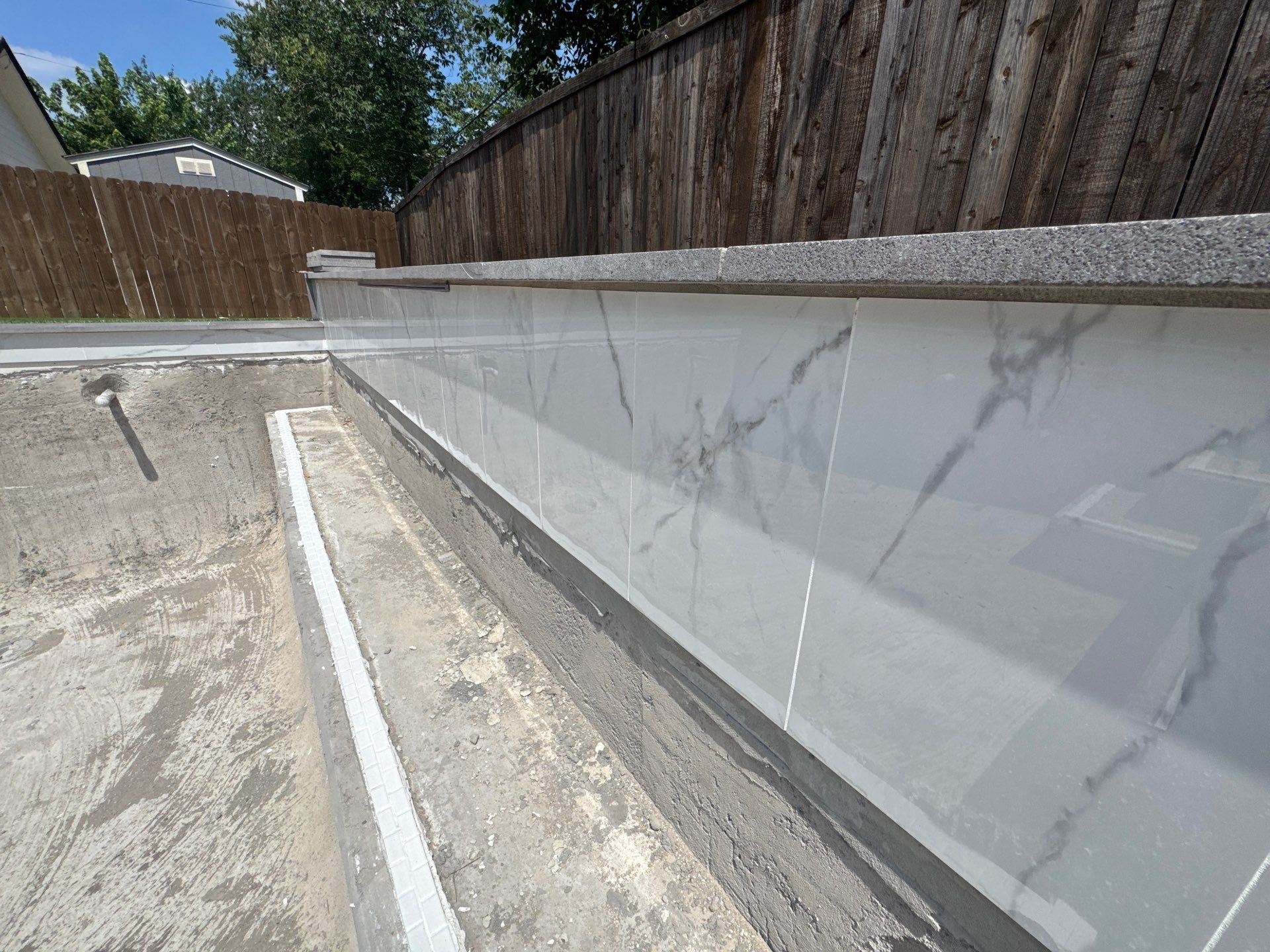 Modern Geometric Pool with Tanning Ledge and Turf by Pinnacle Pools and Spas - DFW