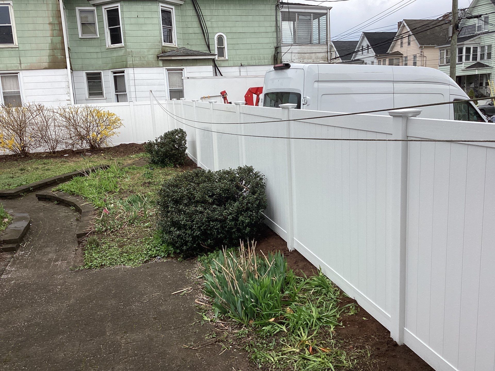 Fence replacement with white Vinyl privacy fence. by DiGiorgi Roofing and Siding Inc