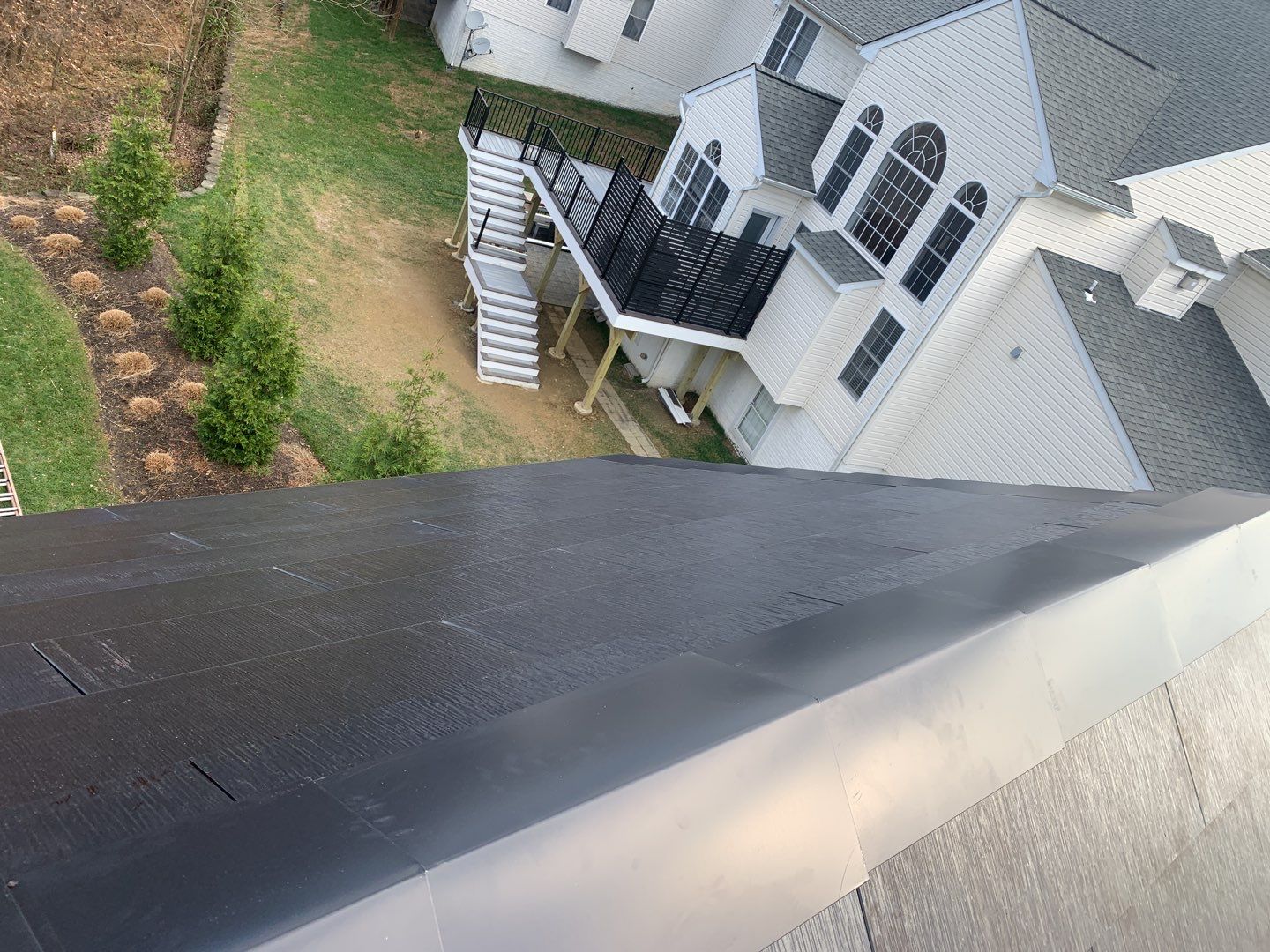 Tesla Solar Roof and Gutter Installation by American Home Contractors