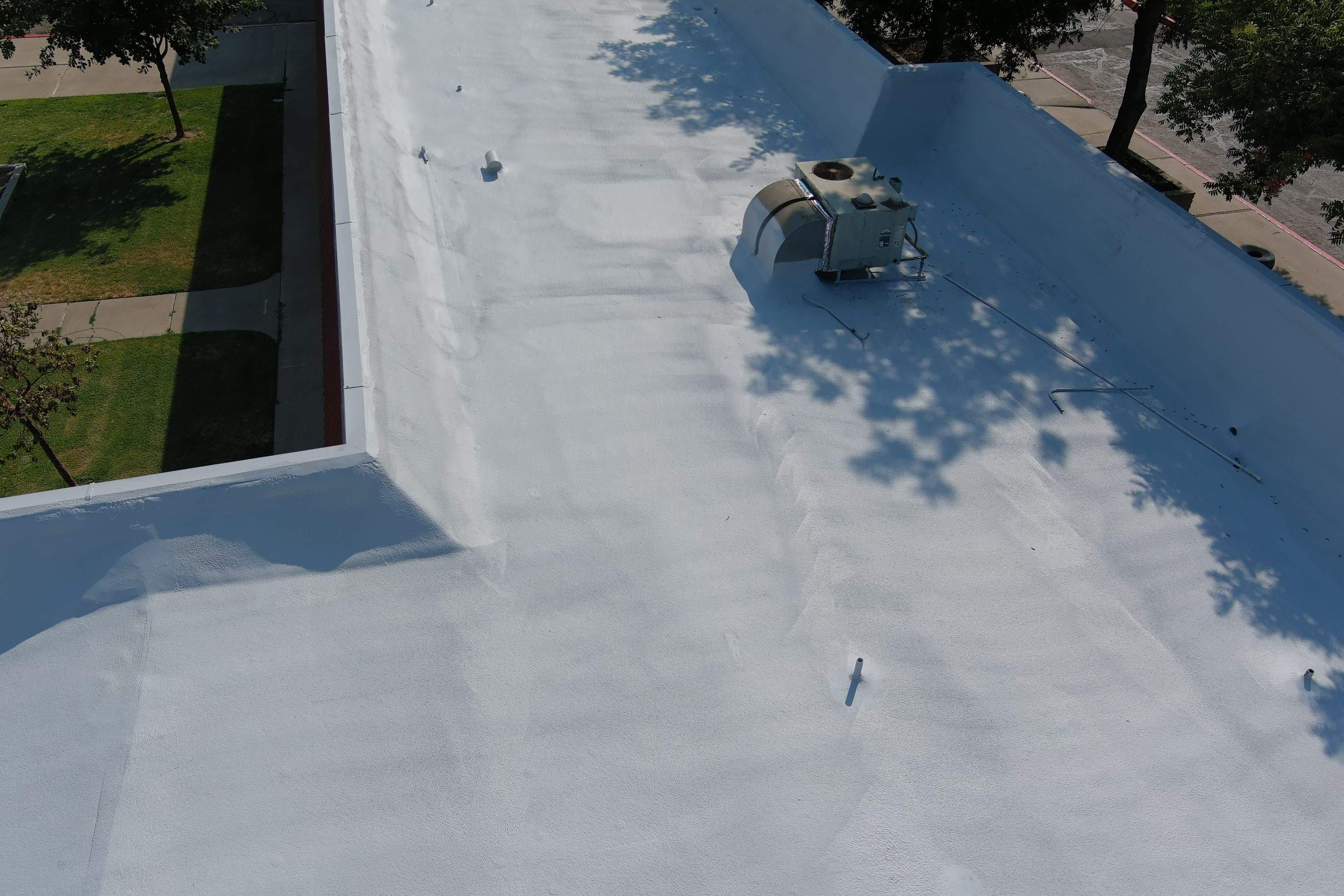 Commercial Roofing Installation using General Coatings acrylic coatings and spray foam by Straight Edge Roofing Inc