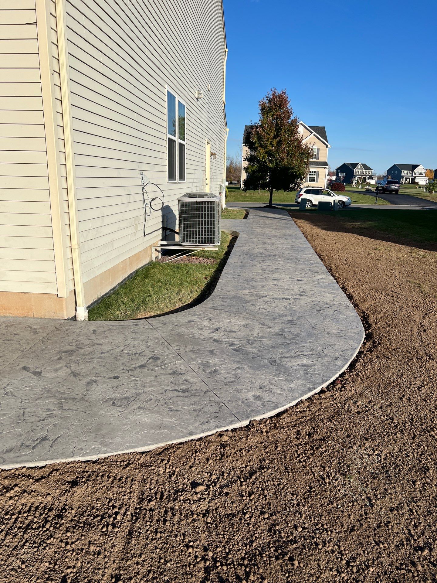Oxford Slate stamped concrete patio  by NG Masonry & Construction LLC