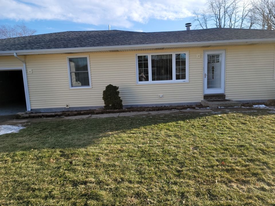 taking down brick wall & installing siding by Kraz Construction