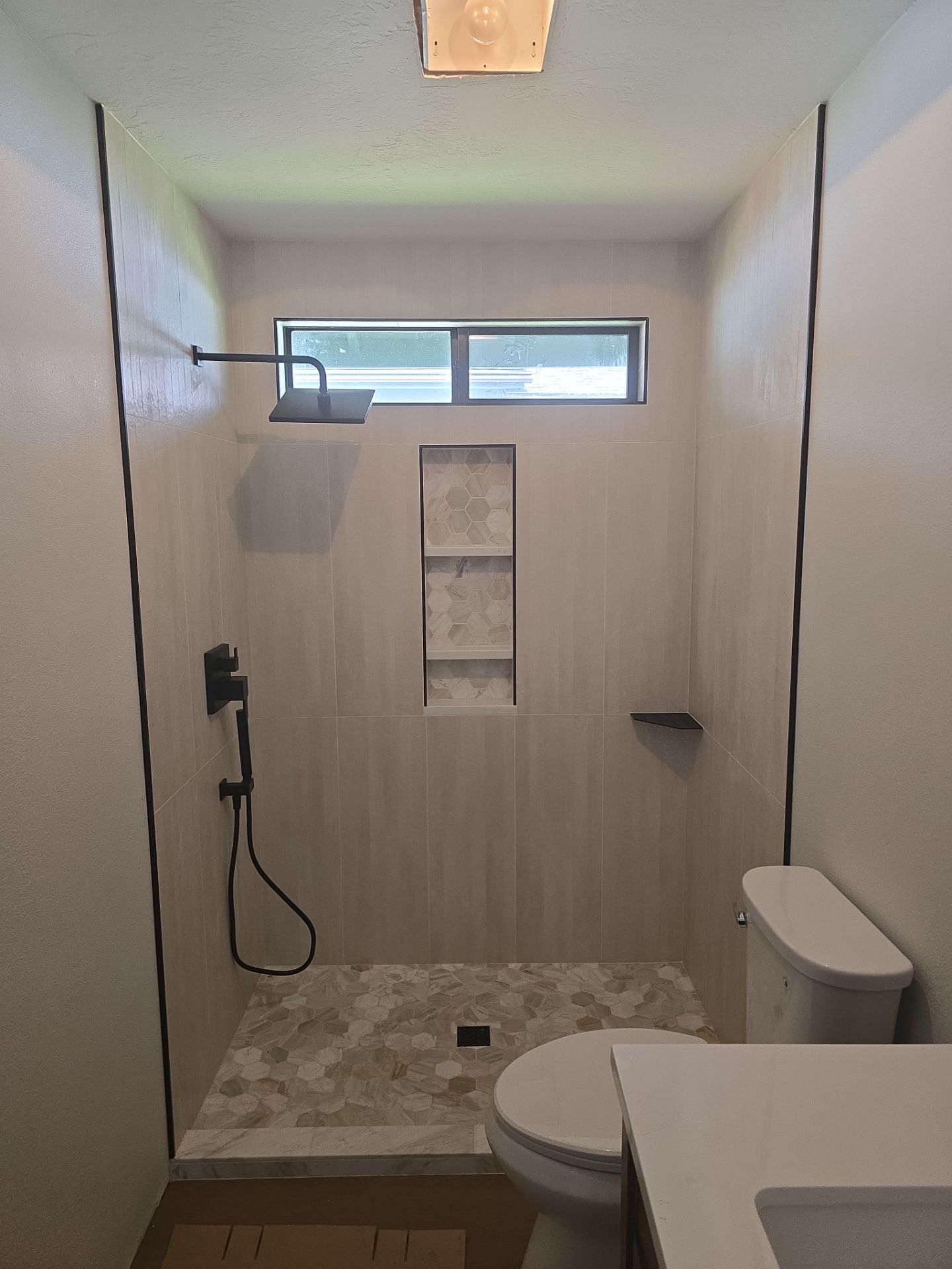 Full Interior Renovation Featuring Custom Tile Shower and Fireplace in Brookings
