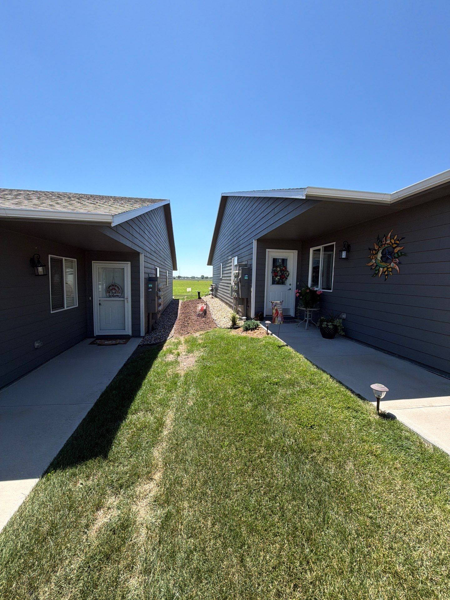 Starry Evening Concrete Patio Coating Installation in Tea by Select Painting, Coatings & Garage Cabinets