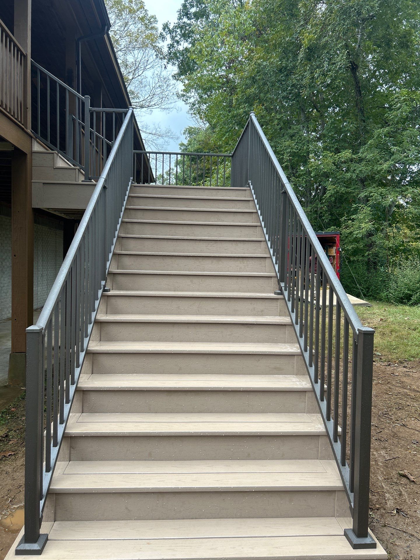 Log Cabin Wrap-Around Deck and External Staircase Installation in Caldwell by Walnut Hollow Decks & Outdoor Living