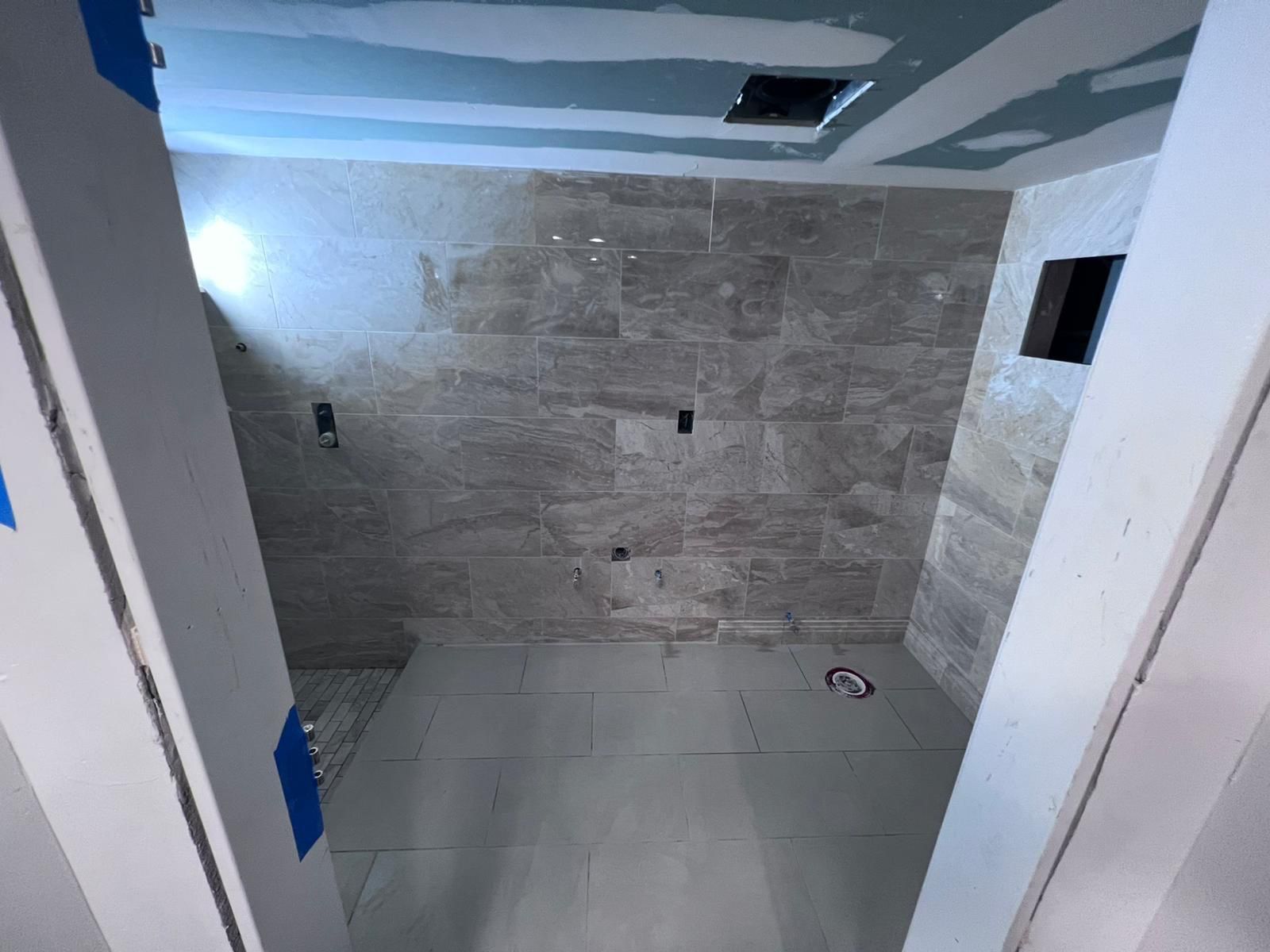 Bathroom Remodel using Tile by Home Concepts Construction