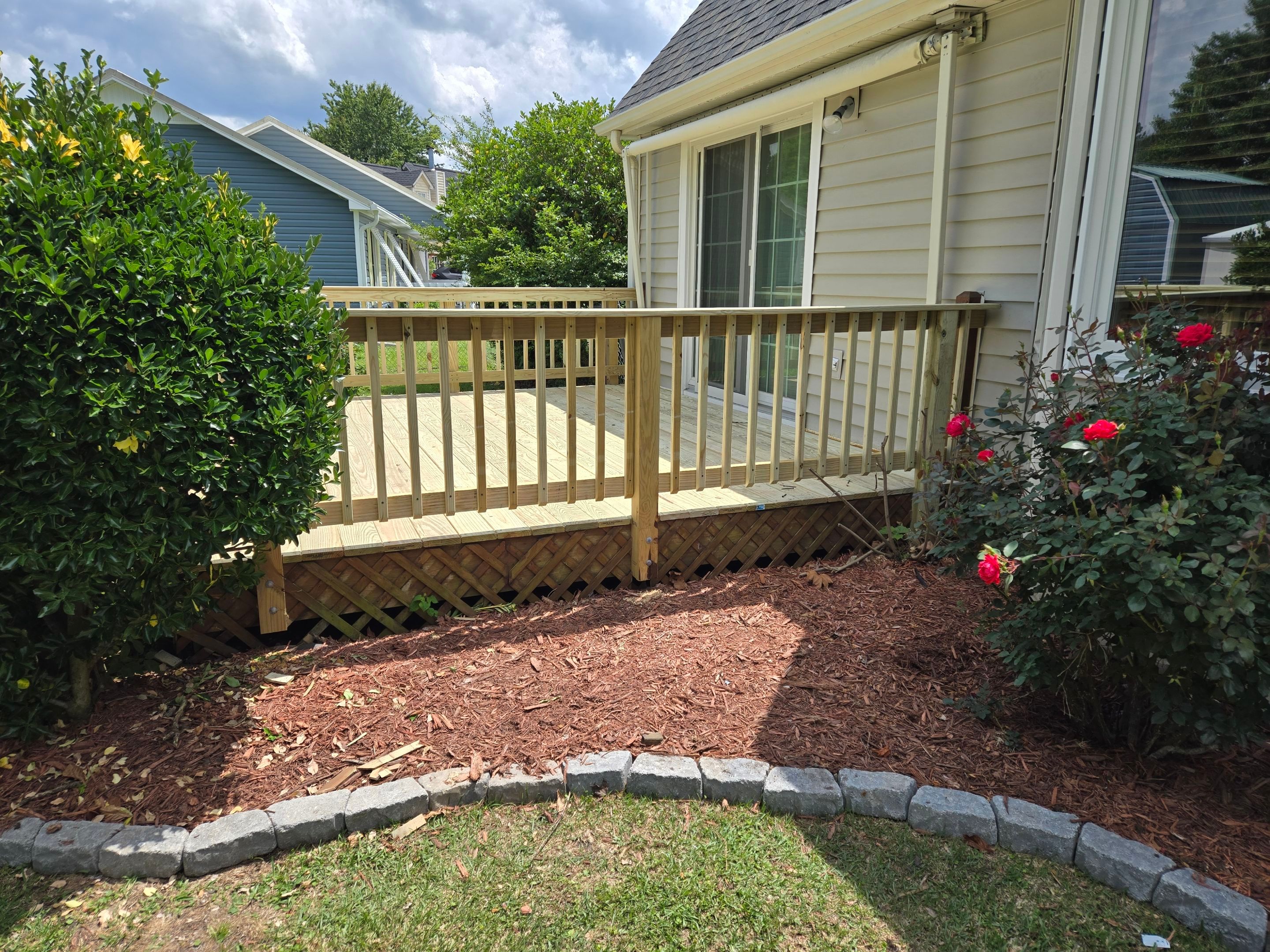 Pressure-Treated Wood Deck Resurface and Railing Upgrade in Havelock by The Remodeling Company
