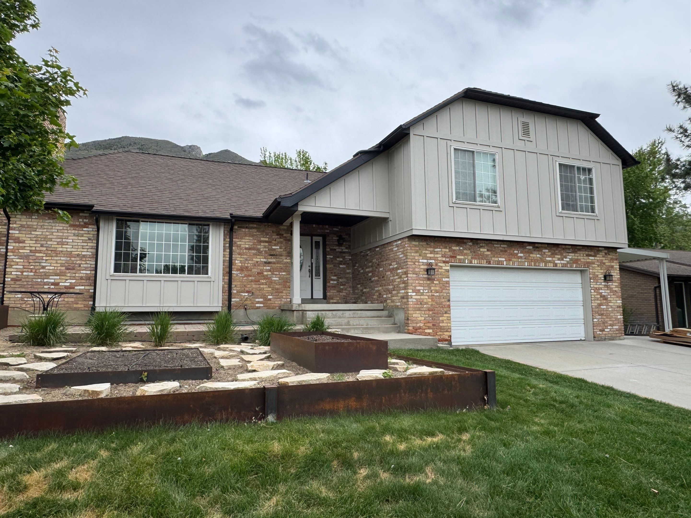 Cottonwood Heights | Custom Hardie Exterior & Bold Fascia | Cobble Stone Accents by Ideal Siding Utah