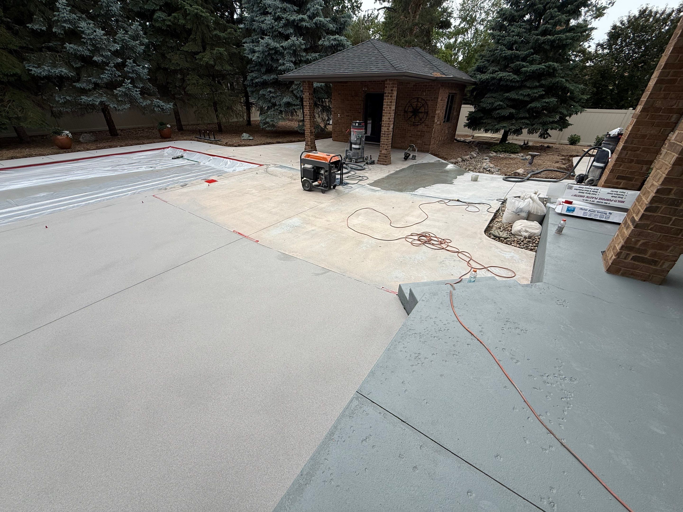 Decorative Concrete Pool Deck and Patio Resurfacing in Sioux Falls by Select Painting, Coatings & Garage Cabinets