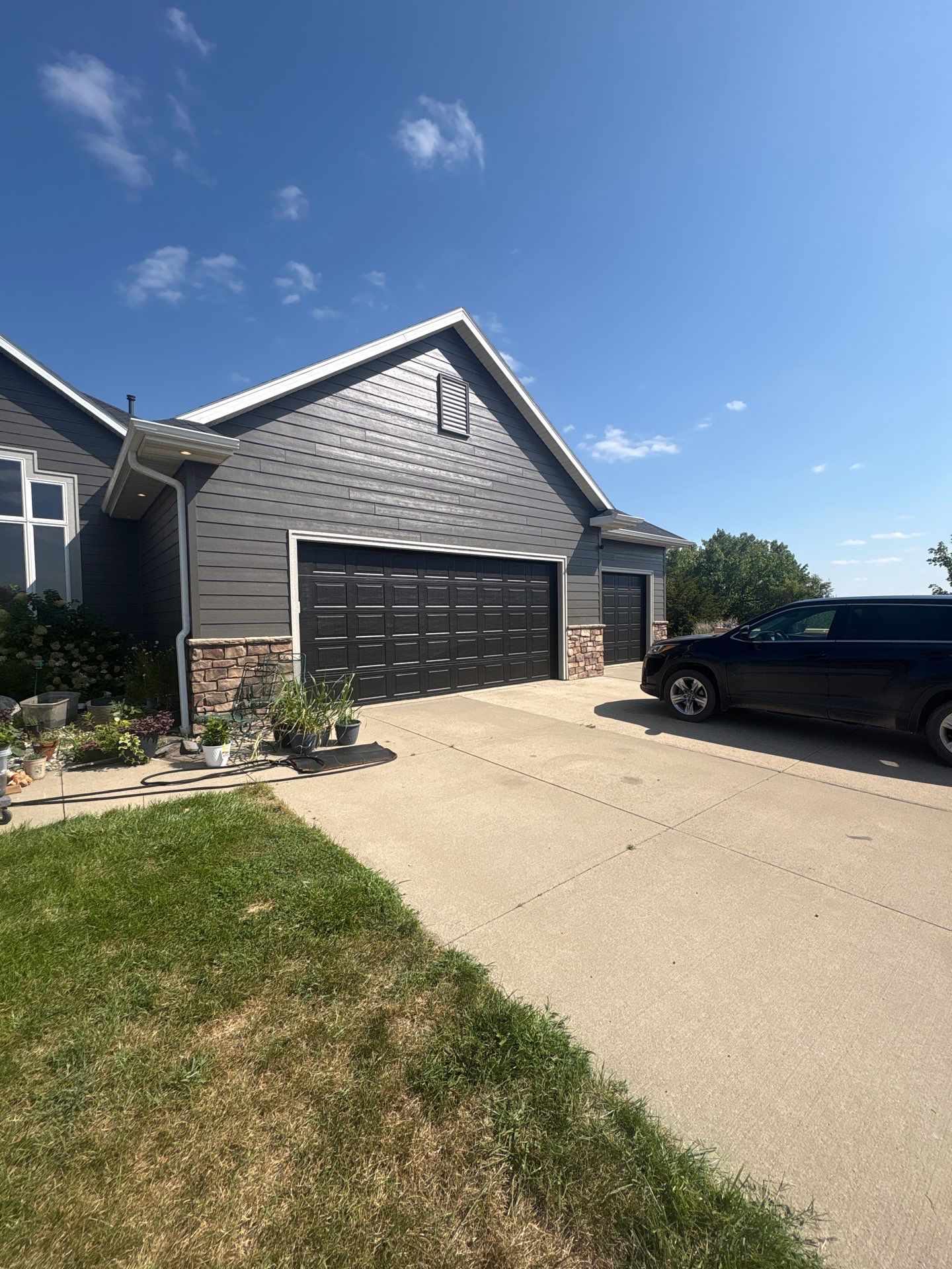 Sioux Falls Residential Exterior Painting and Siding Refresh by Select Painting, Coatings & Garage Cabinets