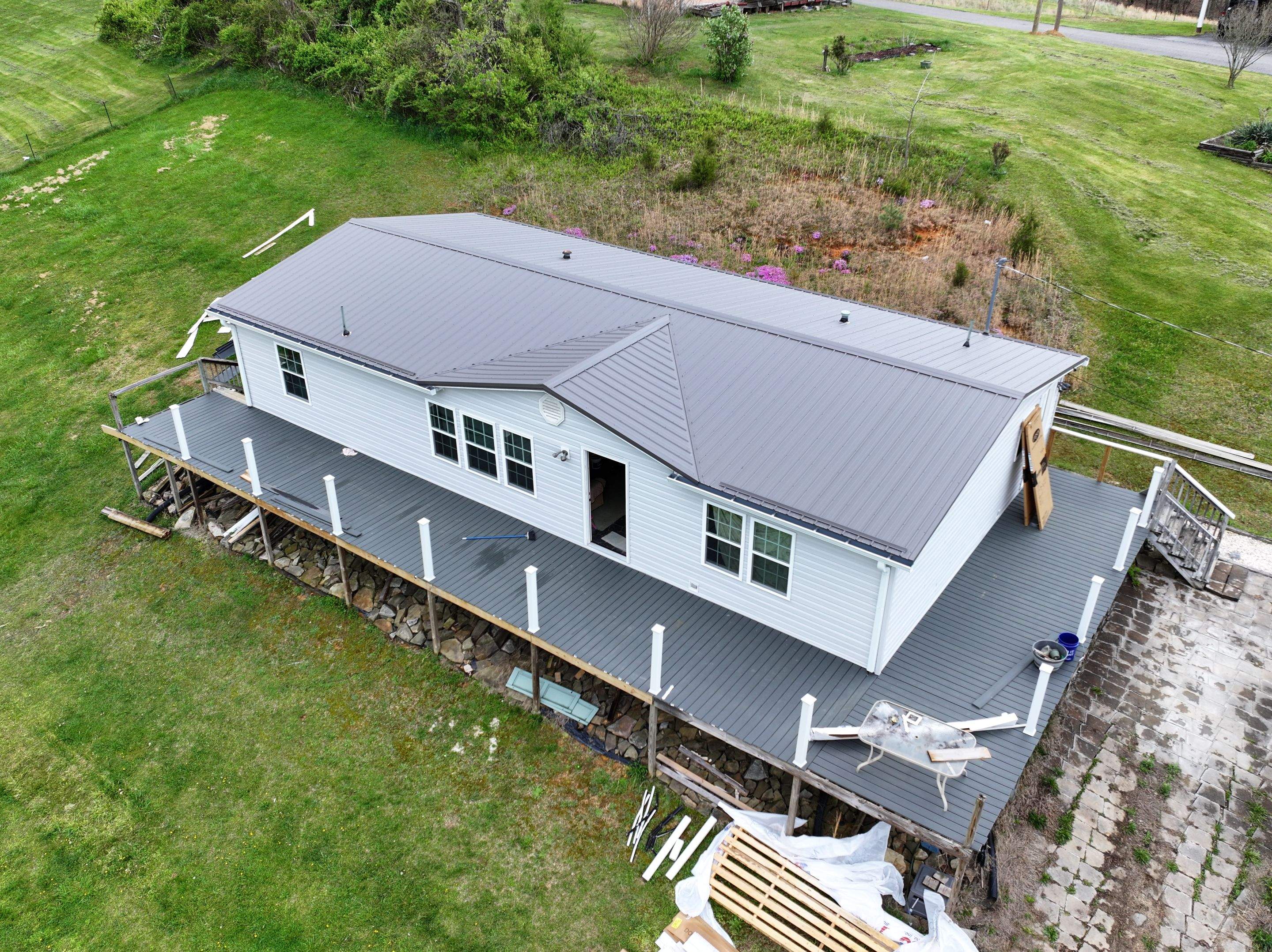 Charcoal Gray Textured Metal Roof by Omnia Roofing