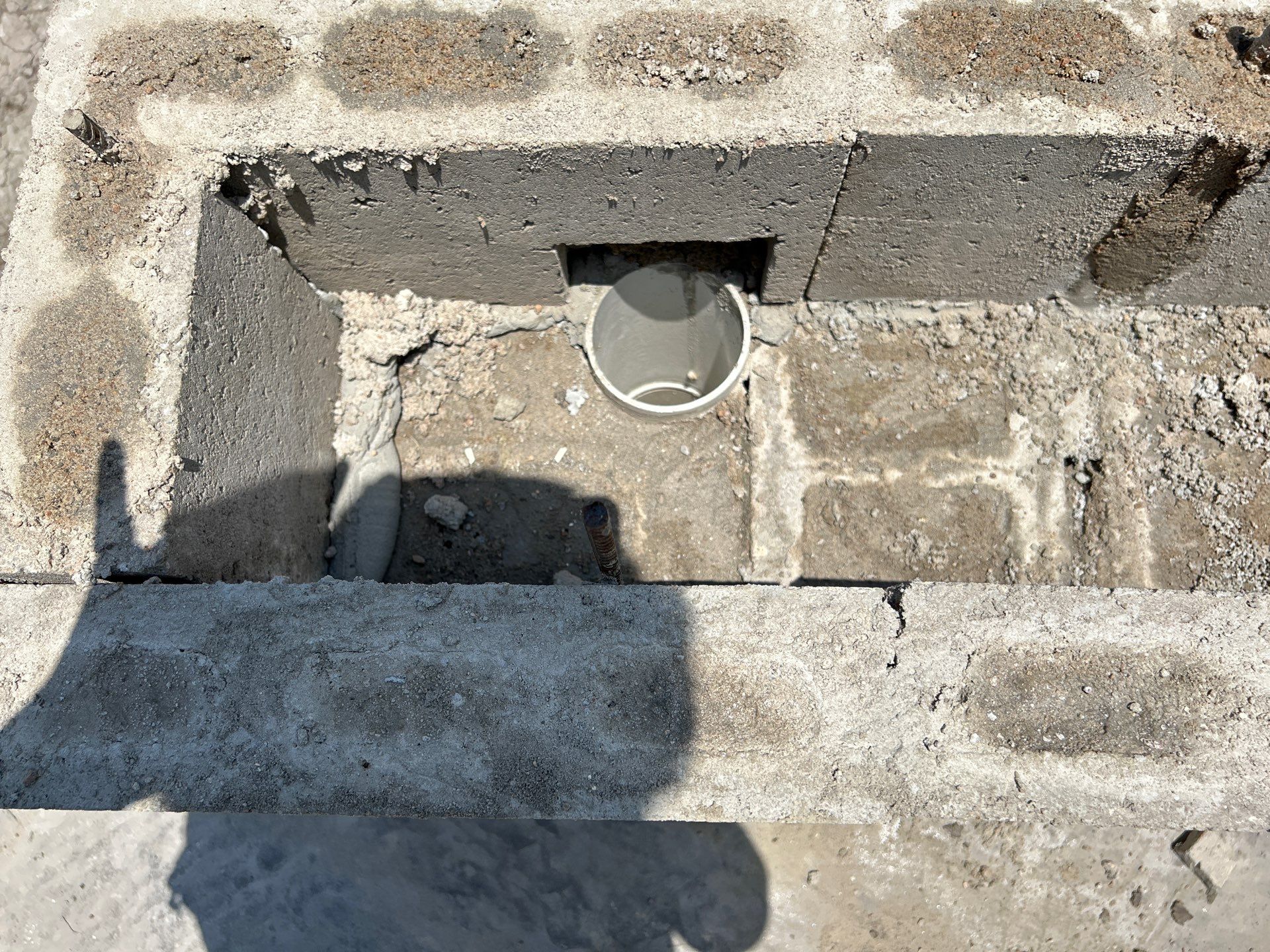 Major Transformation Project: Retaining Wall, Patio, and Drainage for Mr. & Mrs. Veerman! 🤩🛠️ We recently completed a comprehensive, custom project for Mr. & Mrs. Veerman that was all about structure, stability, and stunning outdoor design! This was a multi-phased project requiring the expertise of our Master Handcrafted Team.  Phase 1: Foundation and Water Management A successful outdoor space starts beneath the surface. We focused heavily on preparation and protection:  Demolition & Grading: We professionally removed and disposed of old dirt to achieve a level surface, ensuring the entire area was leveled and graded to enhance both appearance and functionality.  Comprehensive Drainage System: To prevent water issues and protect the new construction, we installed a complete system, connecting existing downspout gutters to channel drainage and strategically placed catch basins around the patio area.  Robust Concrete Foundation: Expert framing led to the pouring of a 4-inch deep, high PSI concrete slab to create a robust and lasting foundation for the entire retaining wall area.  Phase 2: Handcrafted Structure and Style This phase brought in our masonry and carpentry artisans to build the defining elements of the new space:  Custom Retaining Wall: Our master handcrafted team built a stunning, structural retaining wall. This involved careful framing, precise concrete work, and meticulous masonry construction with vertical supports every 3 feet for maximum stability.  Client Involvement: Mr. & Mrs. Veerman played a key role in selecting the retainer wall fascia and stone materials, ensuring the final look perfectly matched their vision.  Stamped Concrete Patio: We installed a beautiful stamped concrete patio. This decorative concrete work involved imprinting a pattern into the fresh concrete, giving them the high-end look of stone or brick with the durability of concrete.  Walk Add-On: Extended the stamped concrete to include a new, seamless walk area.  (Optional) Custom Garden Box: Constructed durable, raised garden boxes using 2"x12" boards and strong 4"x6" posts.  Phase 3: Landscaping and Finishing Touches The final details bring the entire project to life, focusing on irrigation and planting:  Sprinkler System Upgrade: To support their new landscaping, we upgraded their irrigation system by installing two new drip zones and a new control unit.  Flower Beds: Integrated new flower beds along the retaining wall and patio, ready for planting.  Decoration: Concluded the project with personalized decoration options to perfectly complement their beautiful, newly structured space.  Thinking About a Multi-Layered Outdoor Project? This project demonstrates our ability to seamlessly handle complex jobs—from heavy-duty drainage and structural construction to decorative finishes and irrigation.  The proposed timeline for this extensive project was 10 to 15 working days!  ❓ Do you have a sloping yard or drainage issues that could be solved with a functional and beautiful retaining wall? Tell us your challenge! 👇  💡 We specialize in bringing intricate outdoor visions to life! If you're looking for a team with master craftsmen for your next patio, retaining wall, or full landscape overhaul, let's talk. by Texas Urban Elements