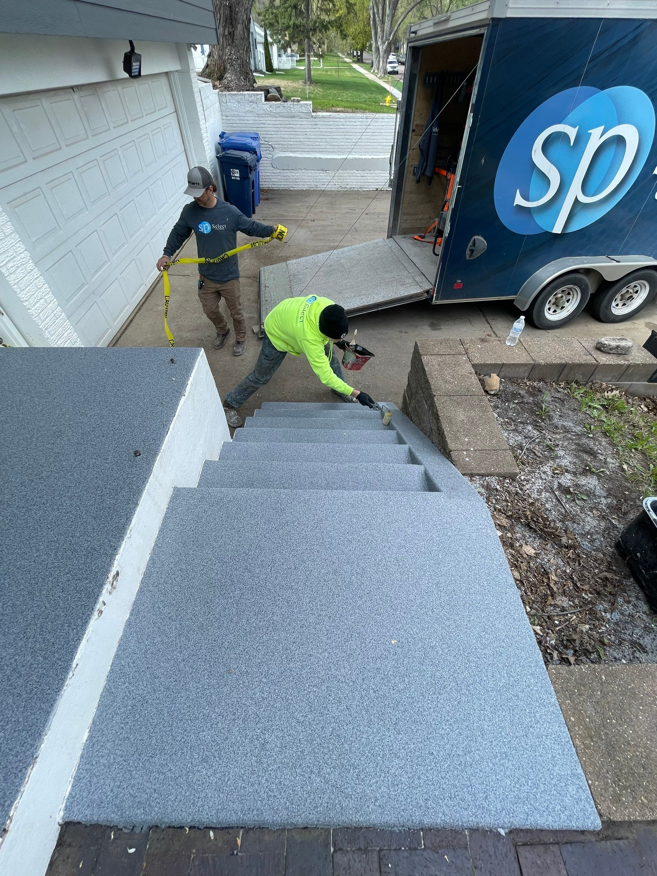 Grey Polyaspartic Porch and Stair Resurfacing in Sioux Falls by Select Painting, Coatings & Garage Cabinets
