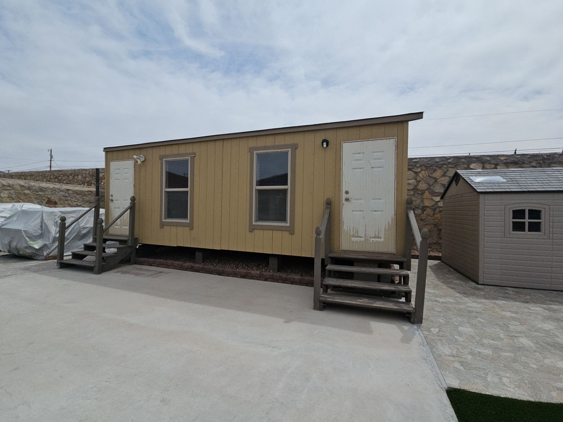 Exterior Building Painting and Repairs with Basketball Court and Playground  by Regal Renovate