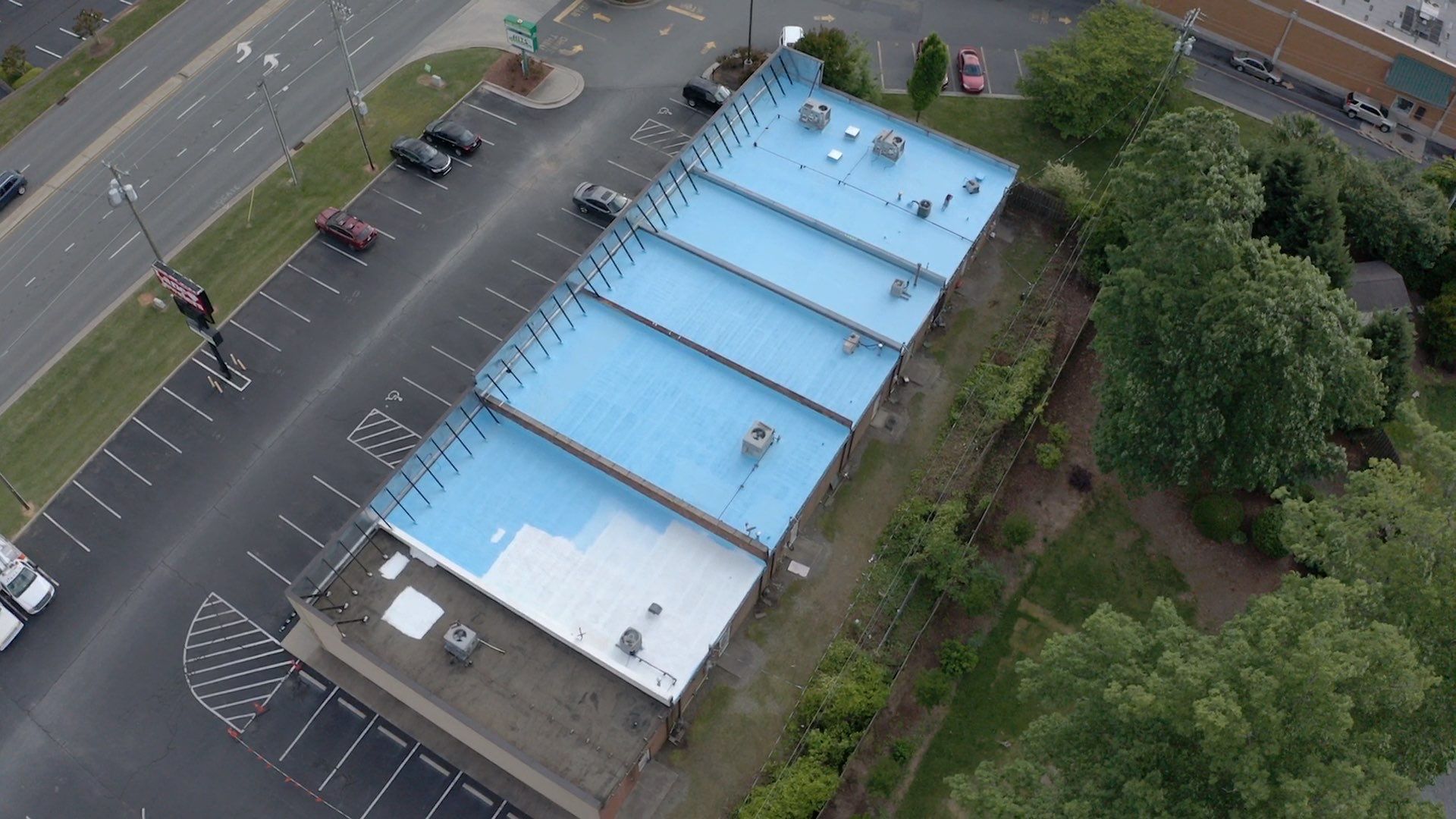 Commercial Roof Coating using Fiberseal basecoat and Silicon Topcoat by Just In Time Roofing and Restoration