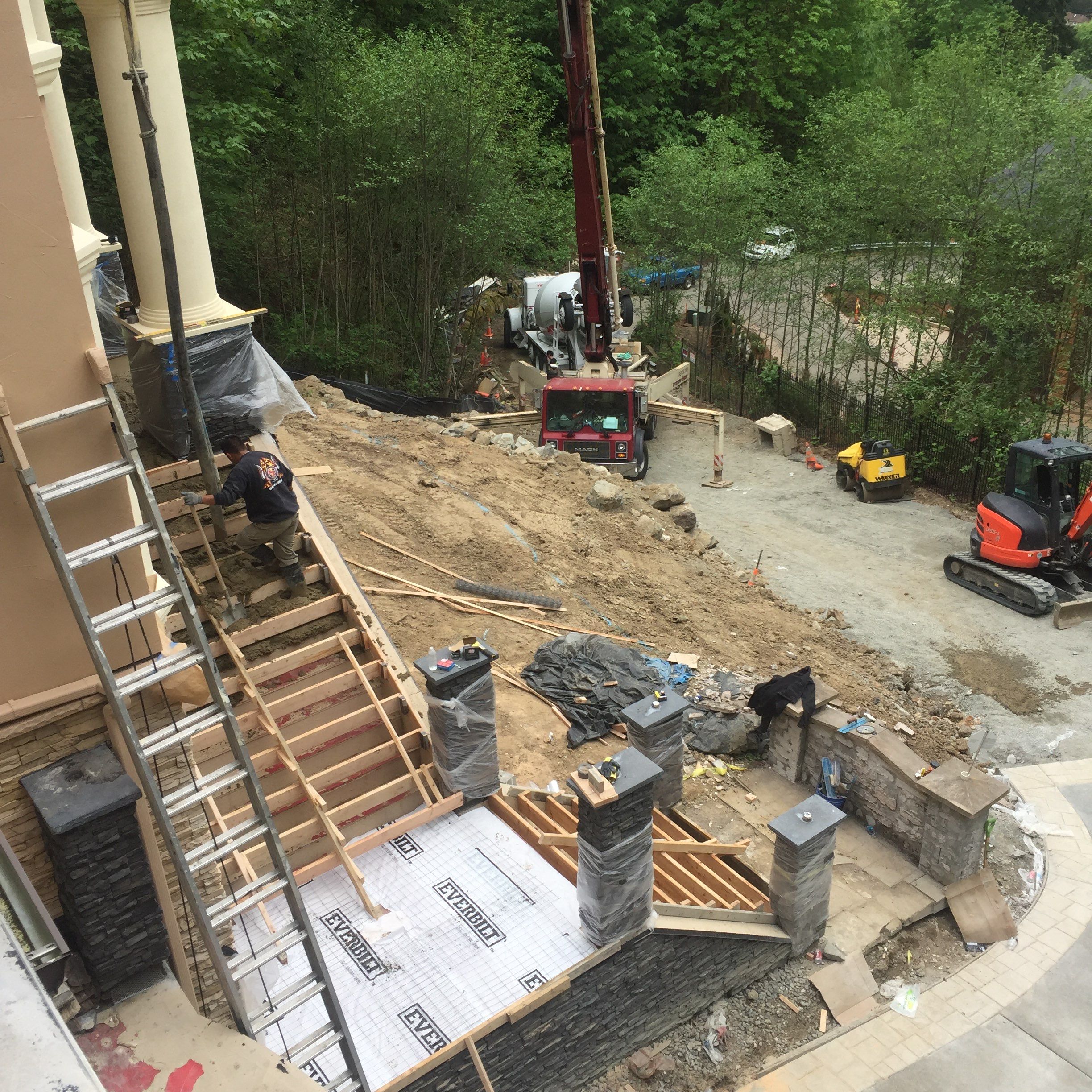 Asphalt Driveway and Stamped Concrete Patio Finish  by Jireh Asphalt & Concrete Inc 