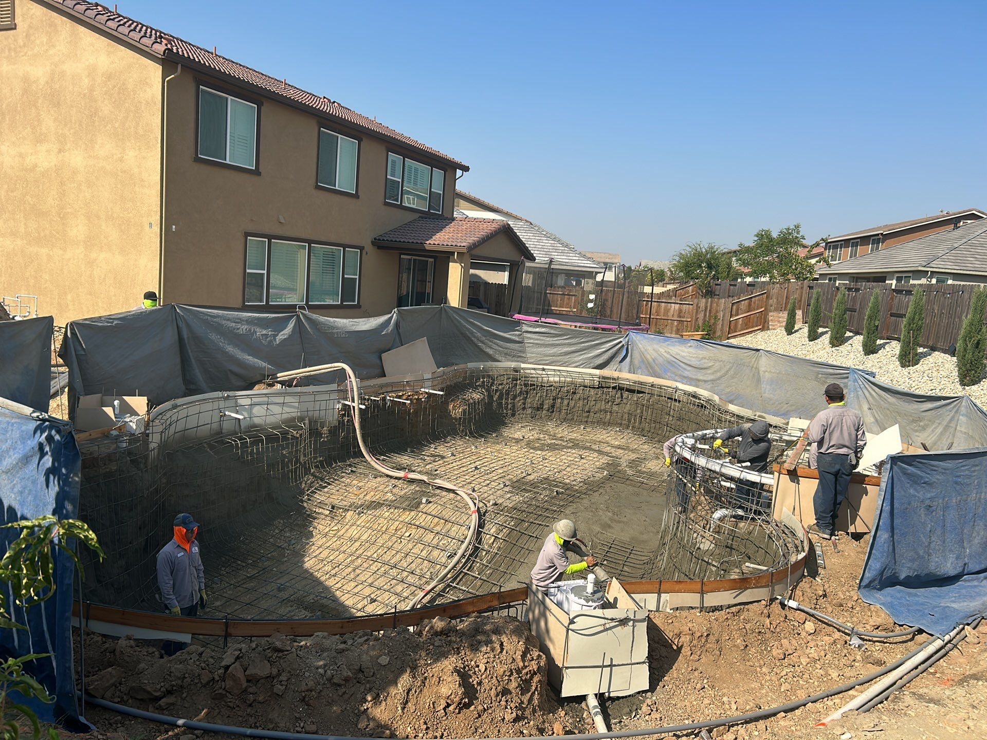 New Pool and Spa with Iridescent Blue Tile in Roseville by Dolphin Pools and Spas