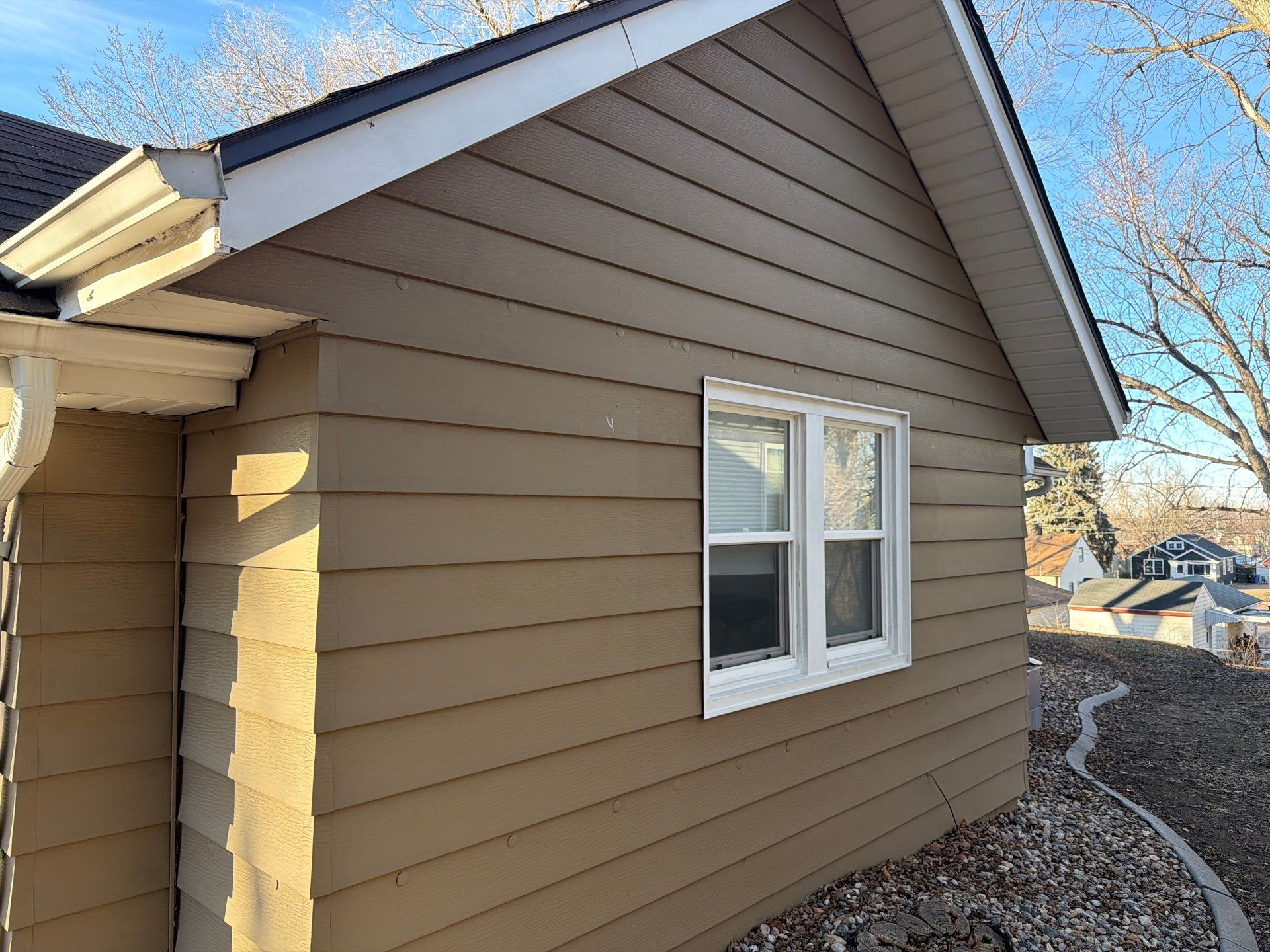 Exterior Siding Repair and Full House Repaint in Sioux Falls by Select Painting, Coatings & Garage Cabinets