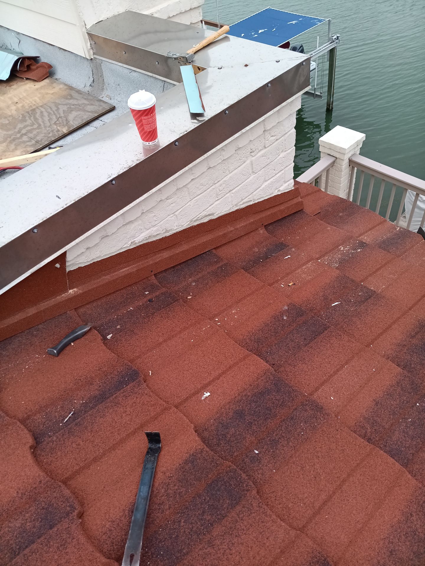 Off with the Tile and on with the TILCOR stone coated metal.  by Bayfront Roofing and Construction
