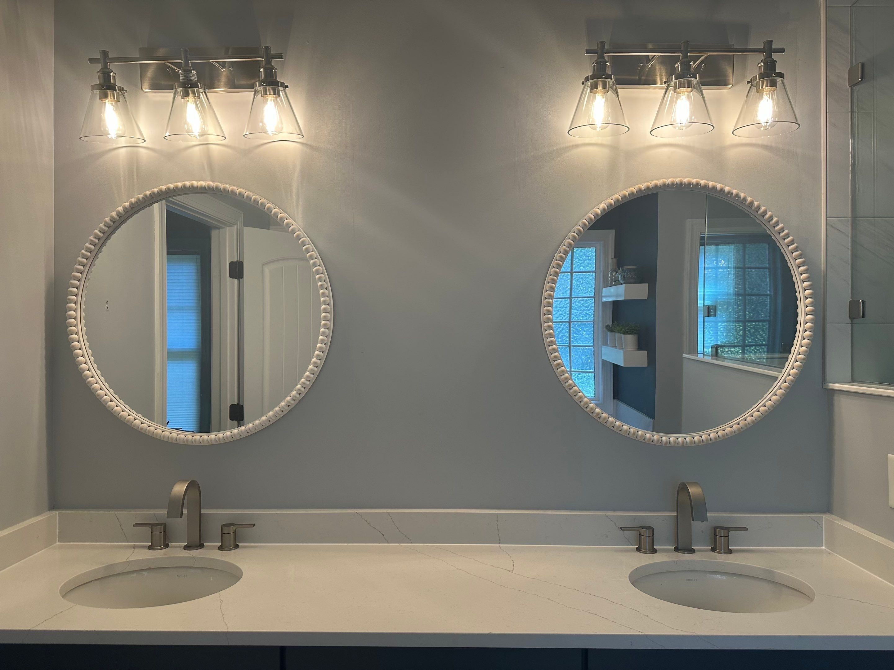 Bright Bathroom Remodel with Wall Removal, Stand Alone Tub and New Vanity by Footprints Floors of Coastal Carolina