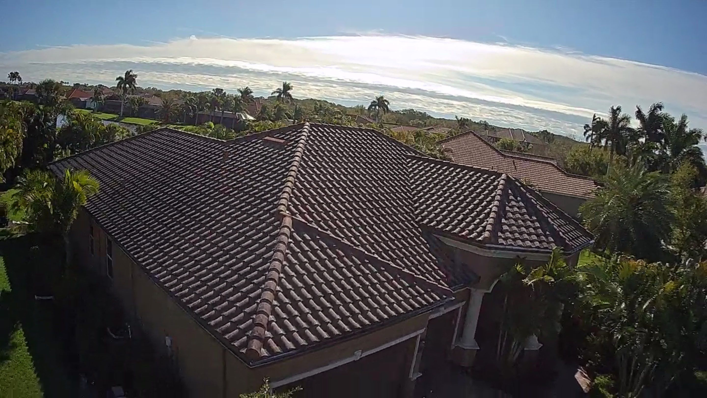 This project focused on a full gutter clean-out to restore proper water flow and prevent overflow issues.  Our scope of work included: 	•	Removing heavy leaf and pollen buildup from the gutter system 	•	Clearing out clogged sections along the rear gutters near the pool cage, where debris tends to accumulate more heavily 	•	Inspecting and cleaning the front gutter guards, which had several blocked areas restricting water flow 	•	Ensuring all downspouts and channels were flowing properly after service  Even with gutter guards installed, debris like pollen, shingle grit, and fine organic matter can still build up over time—especially in Florida’s environment. Regular maintenance helps prevent water damage, overflow, and staining on exterior surfaces.  Another thorough job completed by Sunshine AquaWash® – keeping homes protected from top to bottom. by Sunshine AquaWash