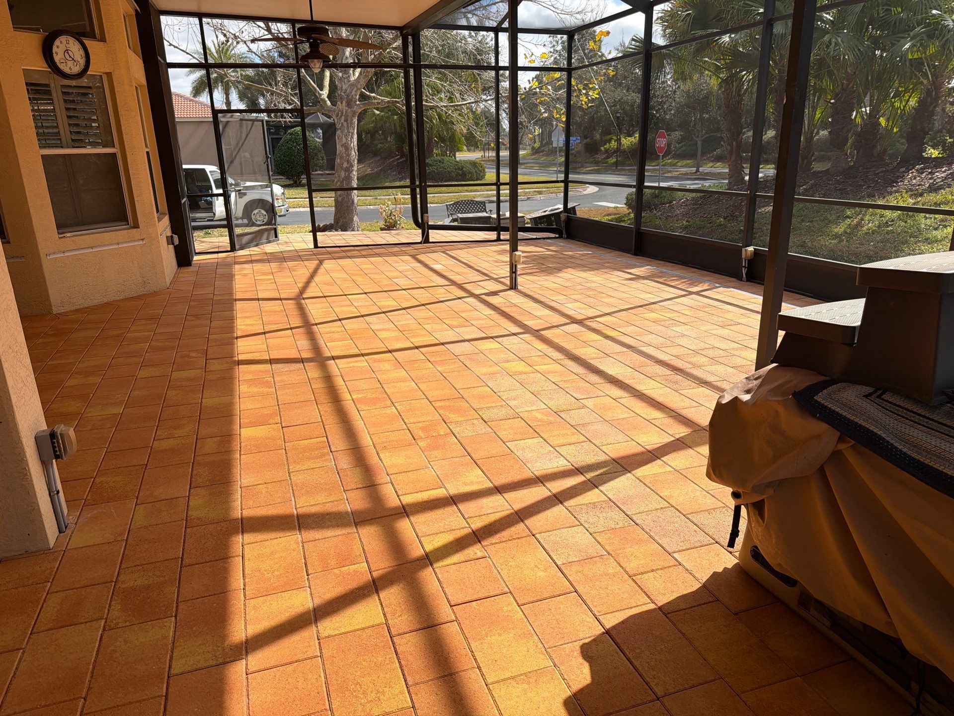 Paver Sealing for Herringbone Driveway and Screened Lanai in Valencia Lakes by Supreme Paver Experts