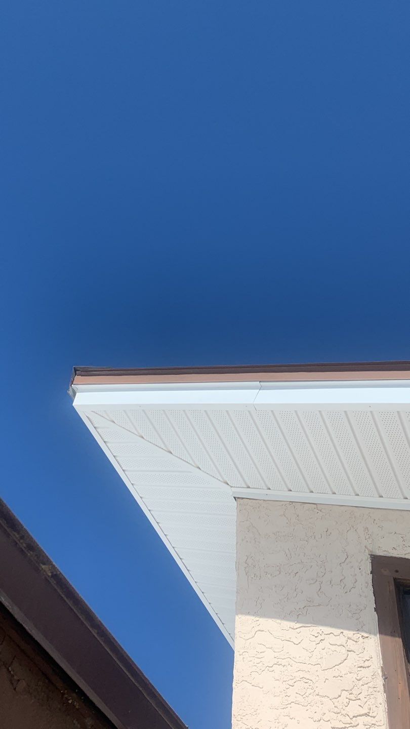 Soffit and Fascia Installation Using White Vinyl Soffit and Musket Brown Fascia by Gutter Professors