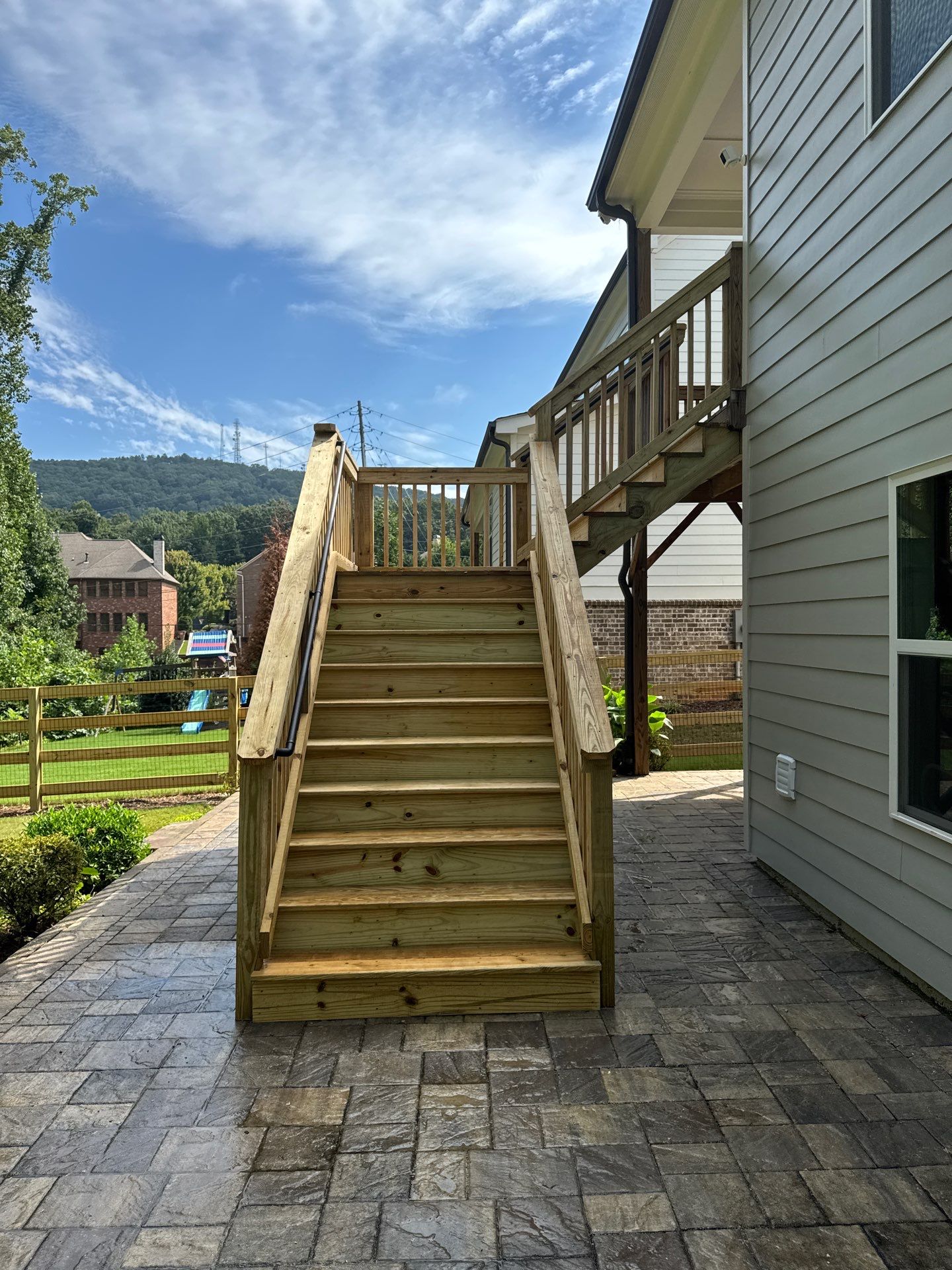 Elevated Deck Stair Construction and Paver Patio in Marietta by Swift Home Renovations