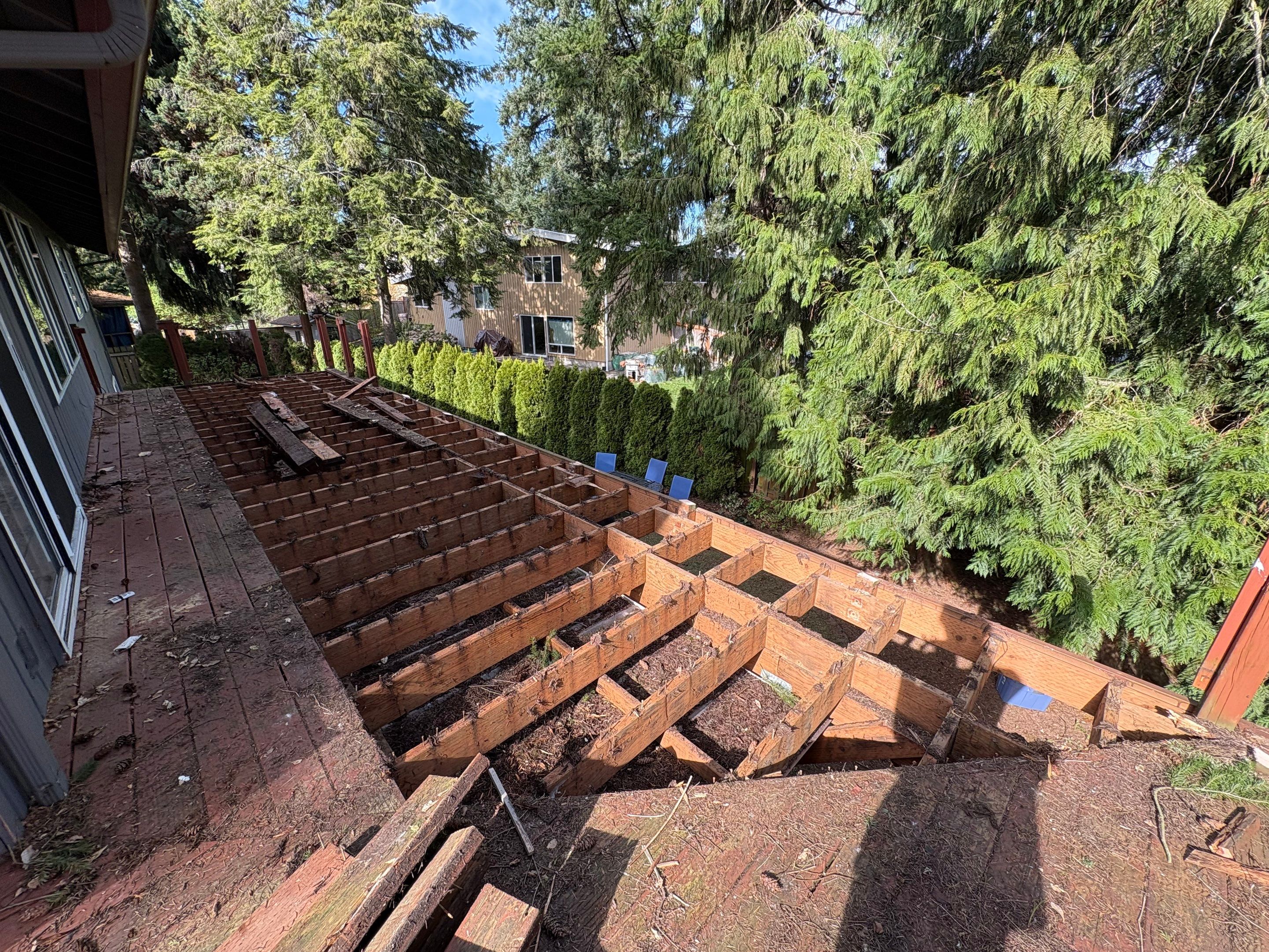 Elevated TimberTech Composite Deck Replacement With Black Metal Railings by Emerald City Energy