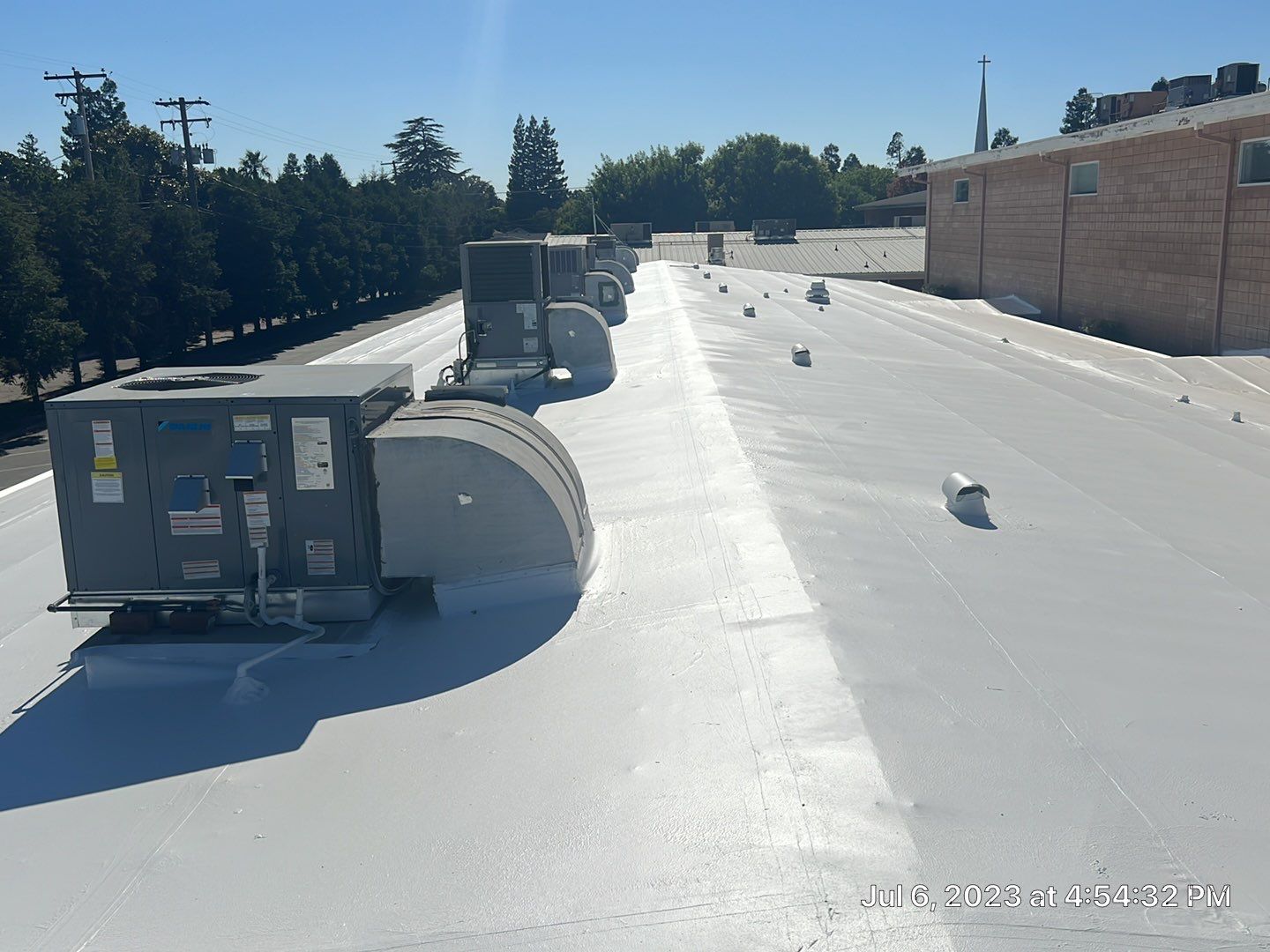 MR Roofing system using Benchmark/PUMA XL coatings over TPO single-ply roofing by Straight Edge Roofing Inc