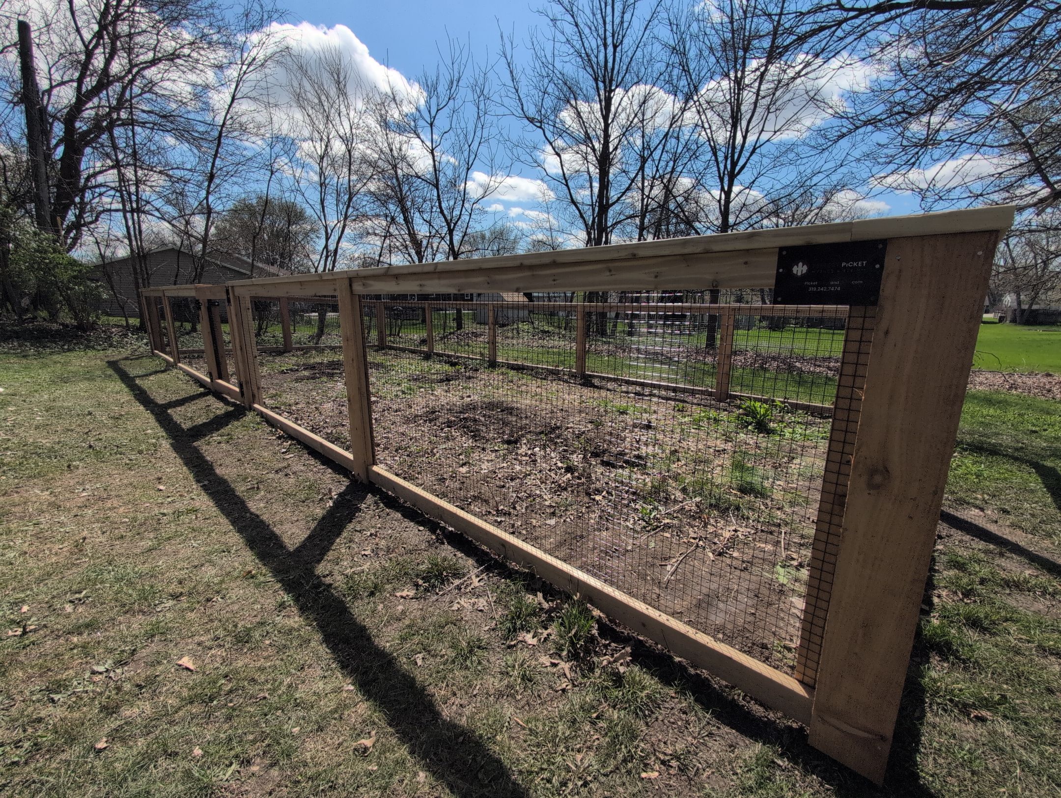 Custom Cedar Wood Garden Fence Installation in Cedar Falls by Perfect Picket Fence and Stain