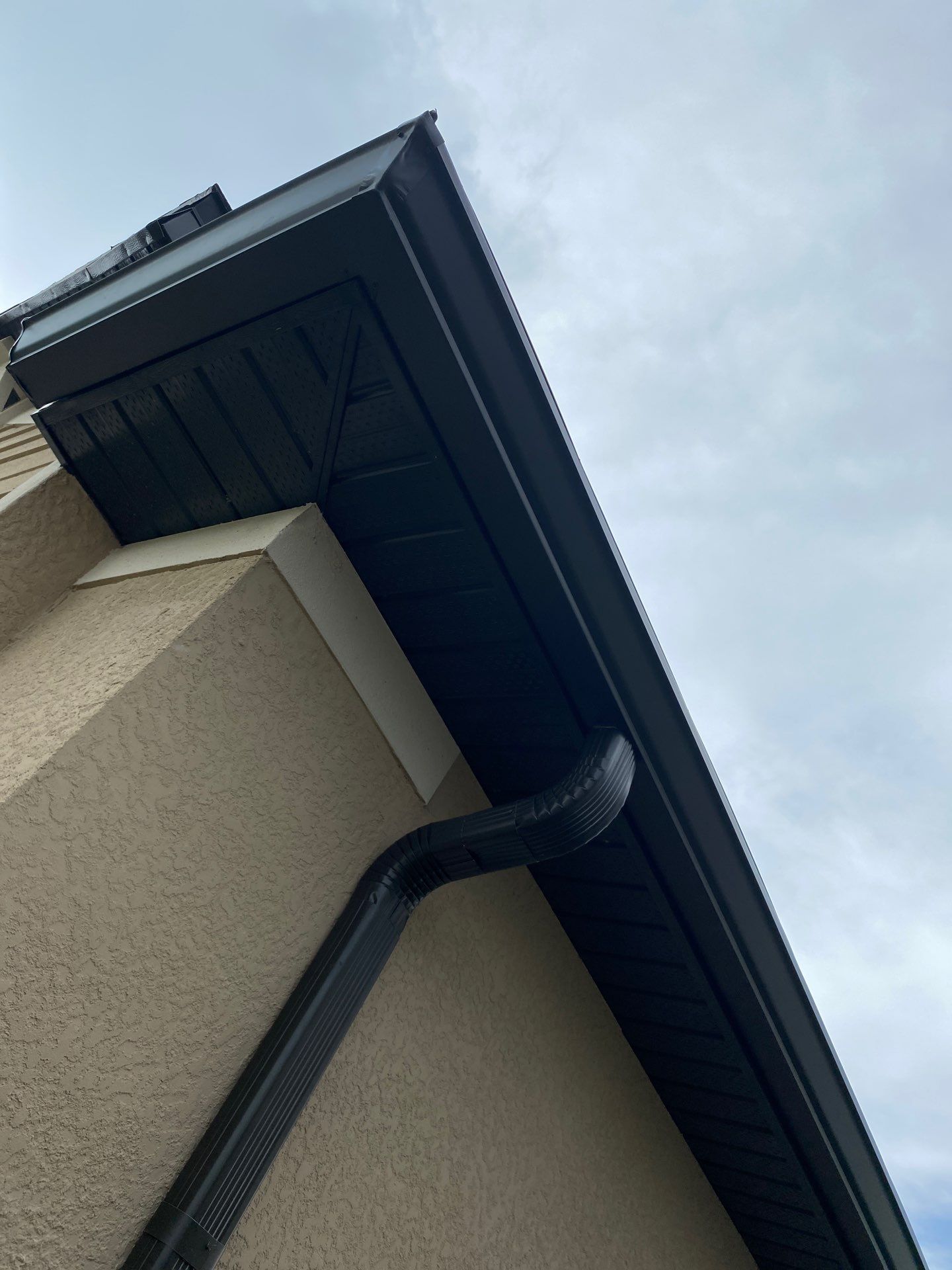 Brown Seamless Gutters for Homes in Fort Myers by Gutter Professors