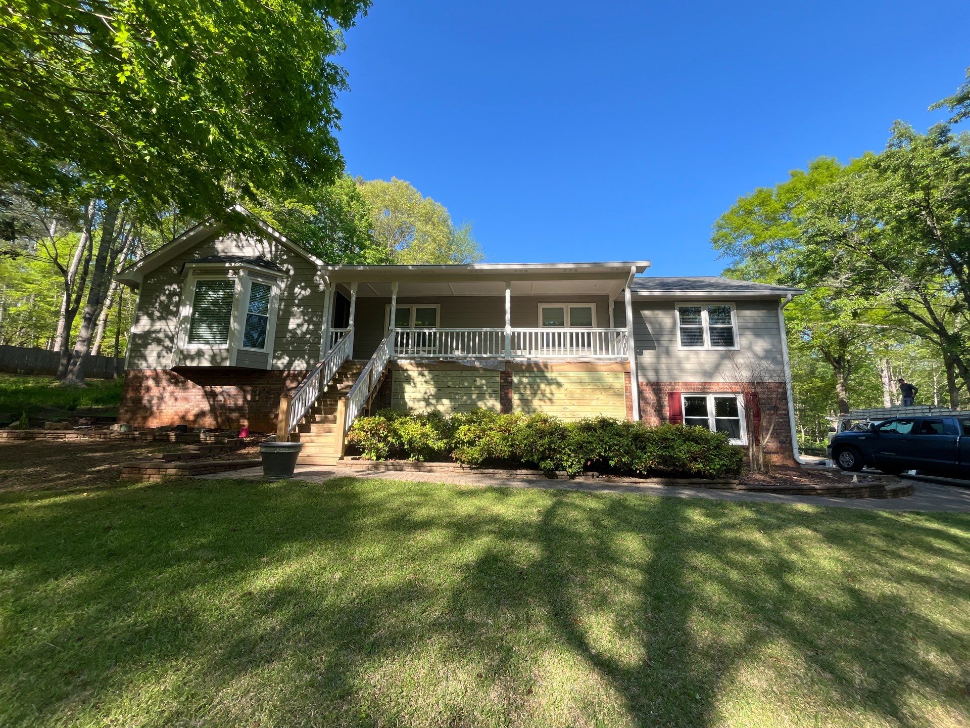 Window, Siding, & Rotten Wood Replacement with Exterior Painting in Woodstock, GA by Nelson Exteriors 