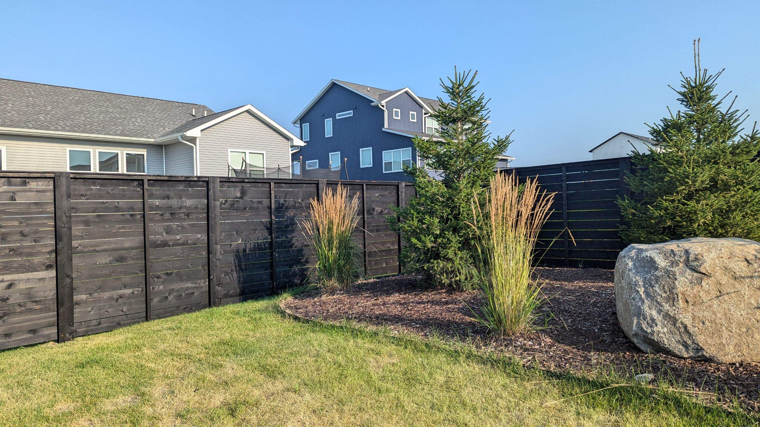 Modern Black Stained Horizontal Privacy Fence Installation in Cedar by Perfect Picket Fence and Stain