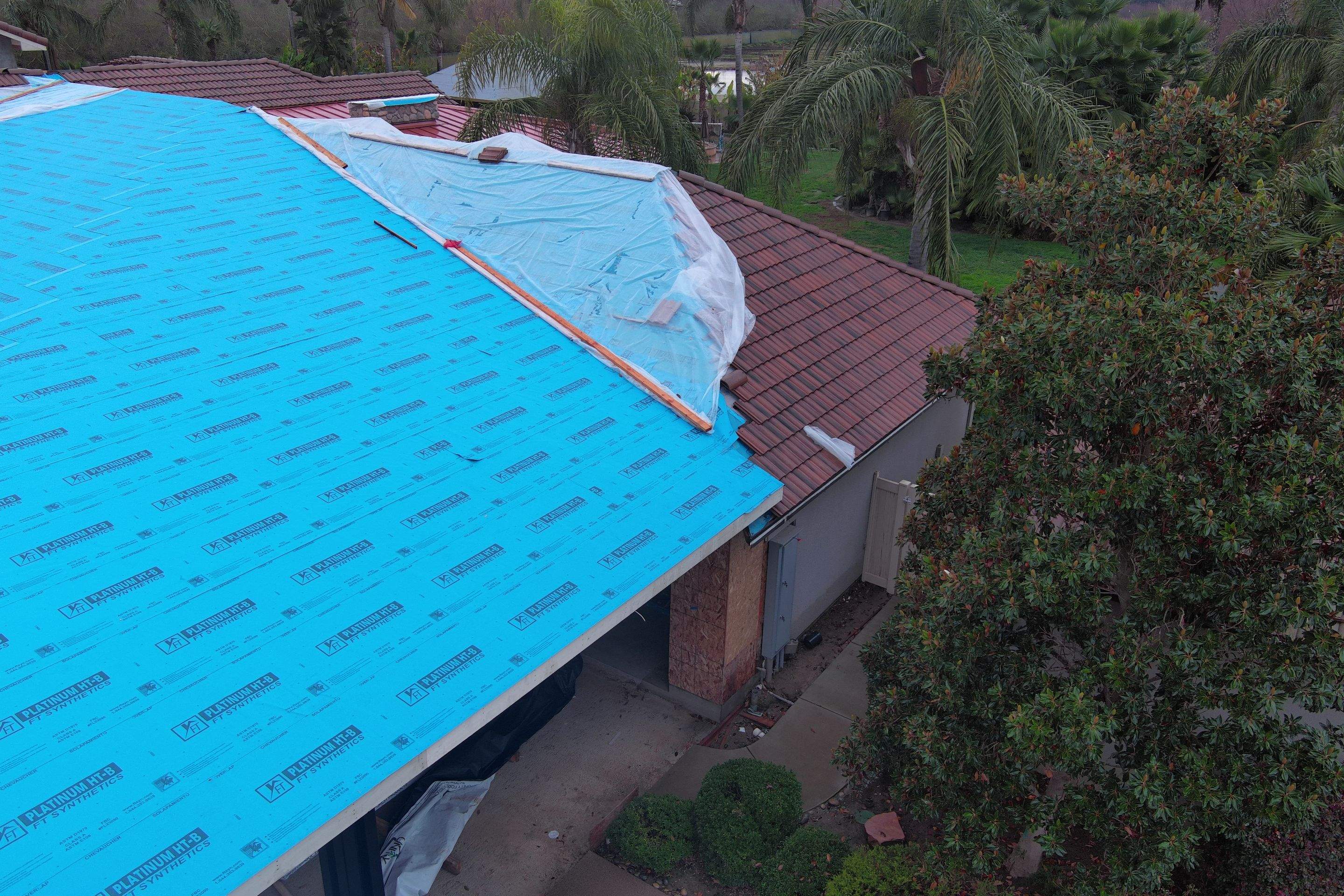 Tile, Metal, and TPO roofing project (new construction) by Straight Edge Roofing Inc