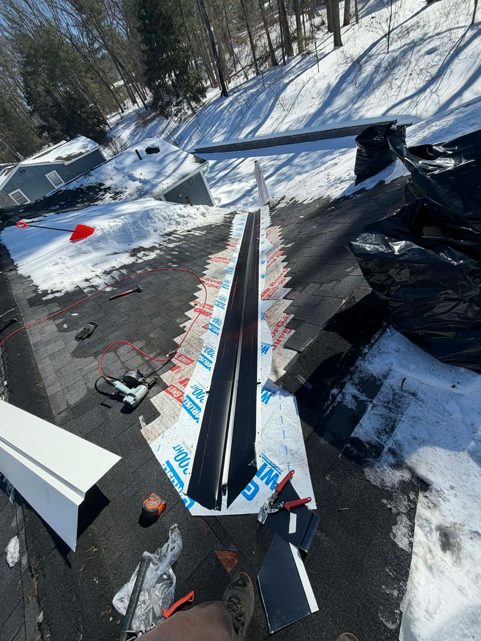 Ridge Cap Replacement & Black Metal Valley Installation in Chelmsford, MA by Mighty Dog Roofing of Greater Middlesex County