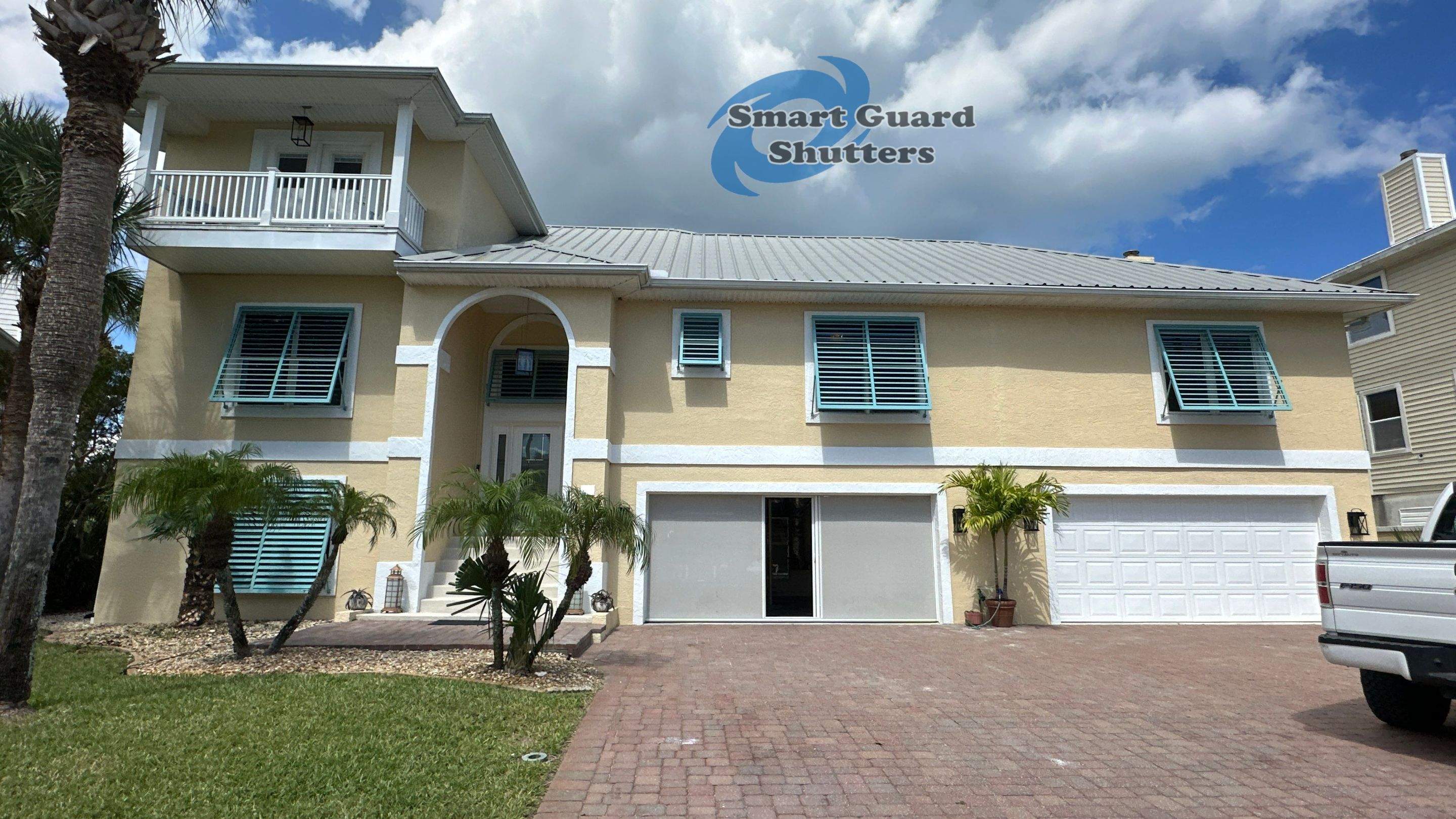 Impact Bahama Shutters in Pastel Turquoise by Smart Guard Shutters
