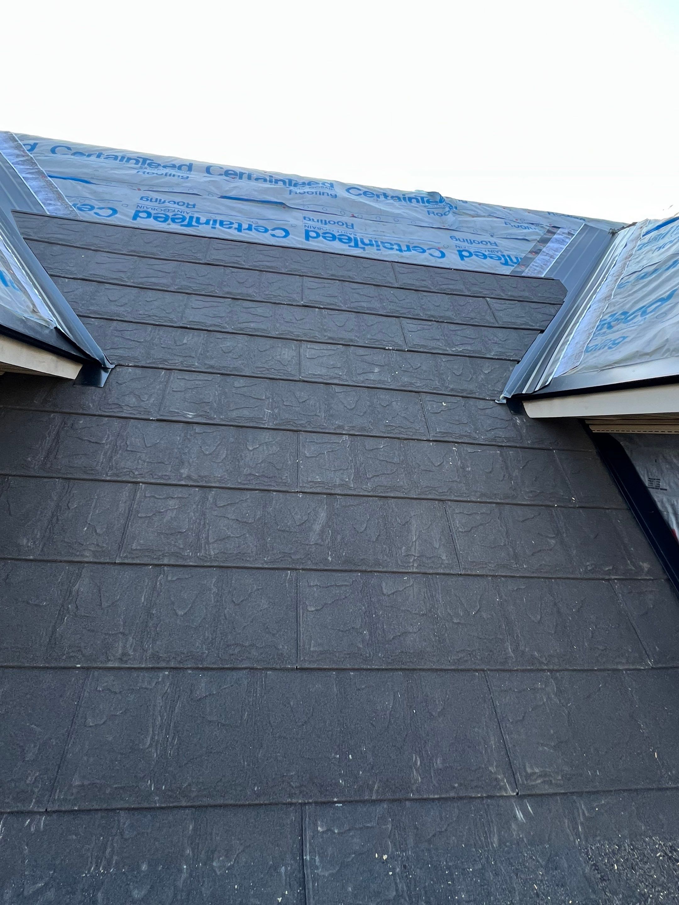 Residential Roofing Repair using Metstar Stone Coated Charcoal by Nitro Roofing and Construction