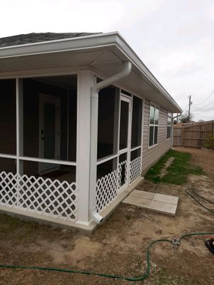 Seamless Gutter Installation Using White 6 Inch Gutters