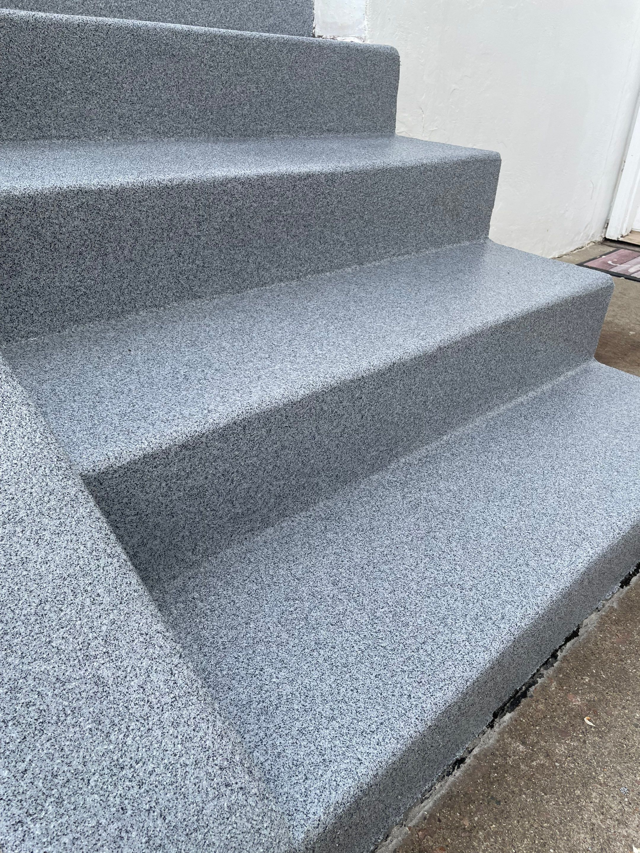 Grey Polyaspartic Porch and Stair Resurfacing in Sioux Falls by Select Painting, Coatings & Garage Cabinets