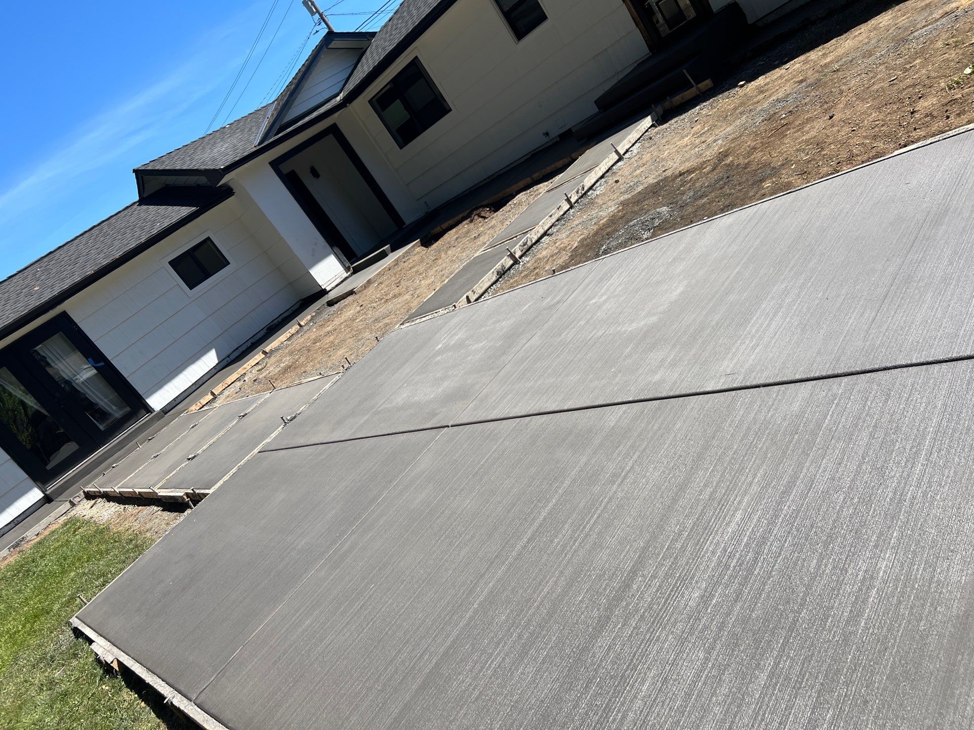 John | Concrete Backyard Walkway by Jireh Asphalt & Concrete Inc 