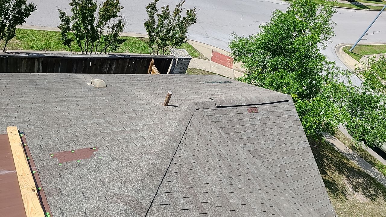 Asphalt Shingle Roof Replacement and Wind Damage Restoration in Manor by Caliber Restoration LLC