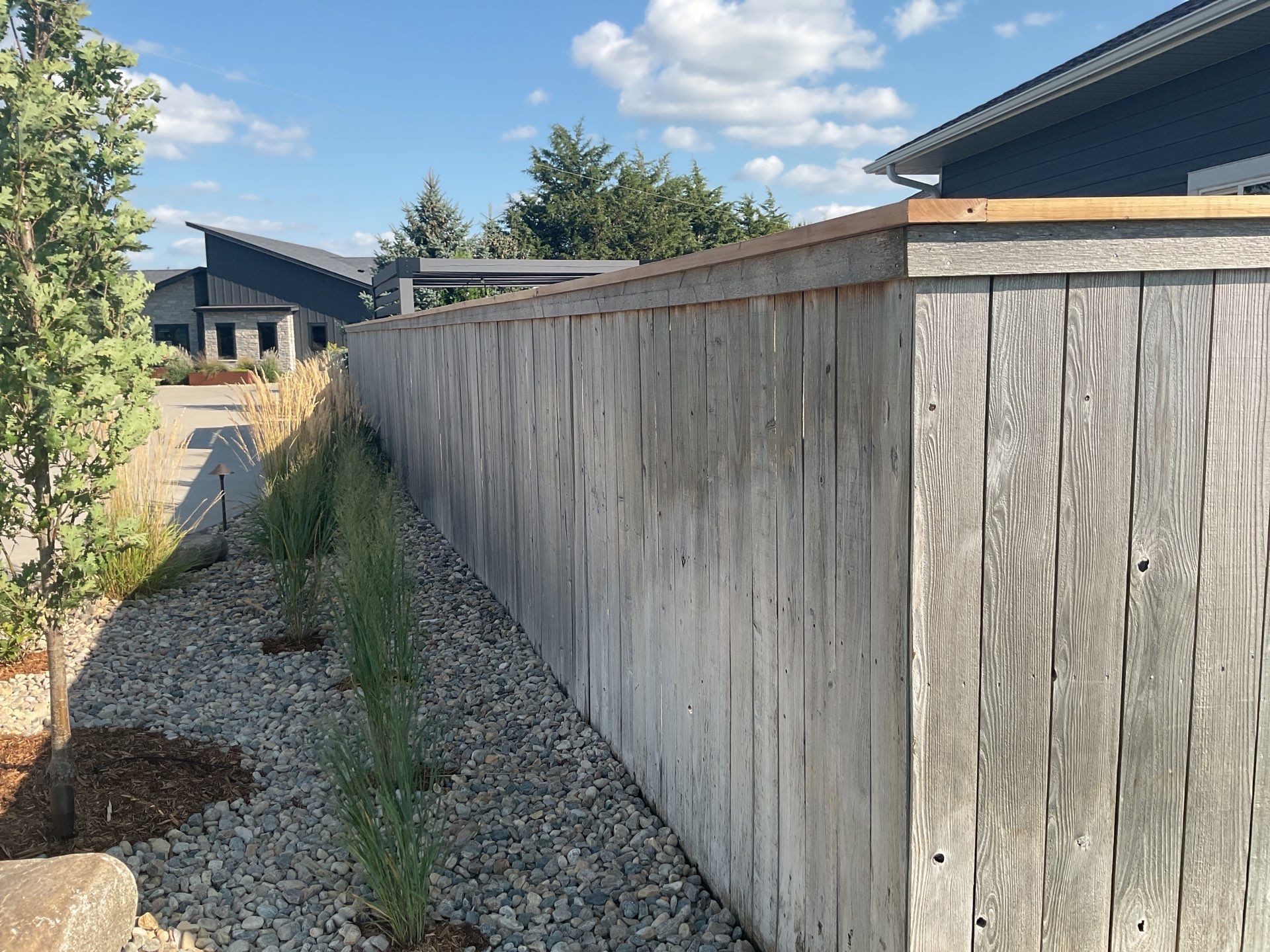 Custom Privacy Fence and Paver Patio Installation in Sioux Falls by Select Painting, Coatings & Garage Cabinets