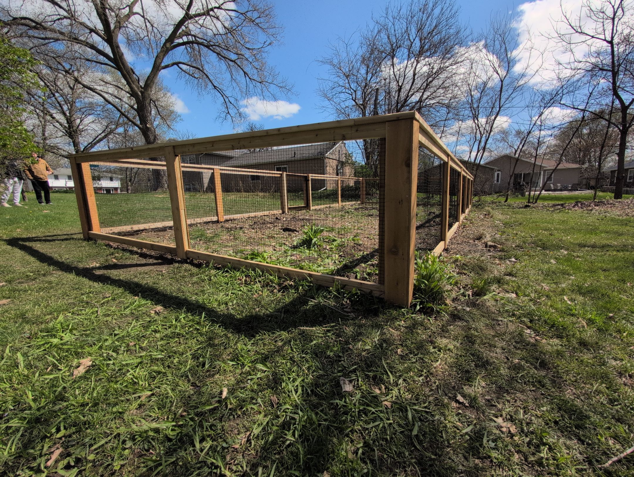 Custom Cedar Wood Garden Fence Installation in Cedar Falls by Perfect Picket Fence and Stain