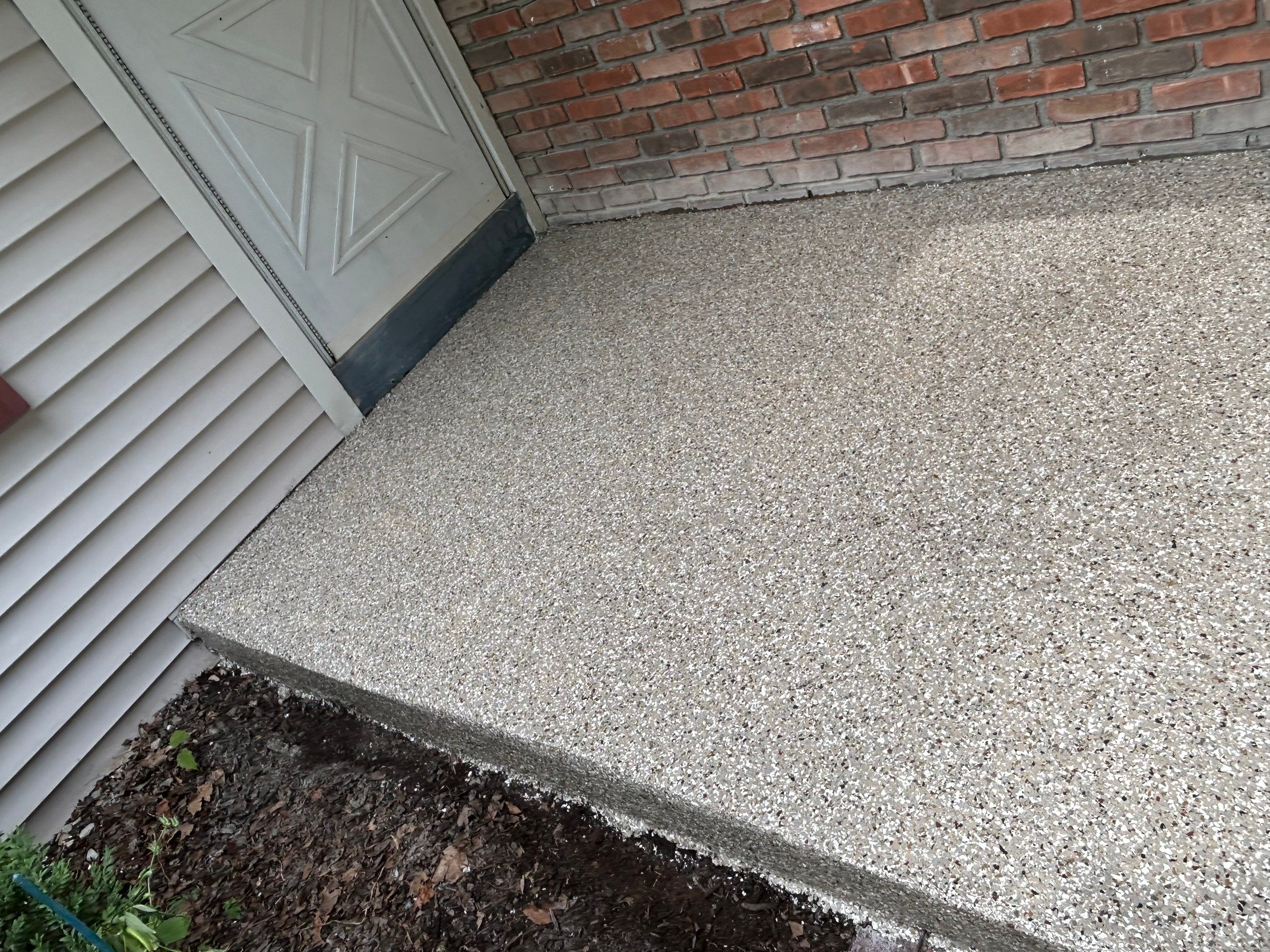 Concrete Floor Coating Transformation by DiGiorgi Roofing and Siding Inc
