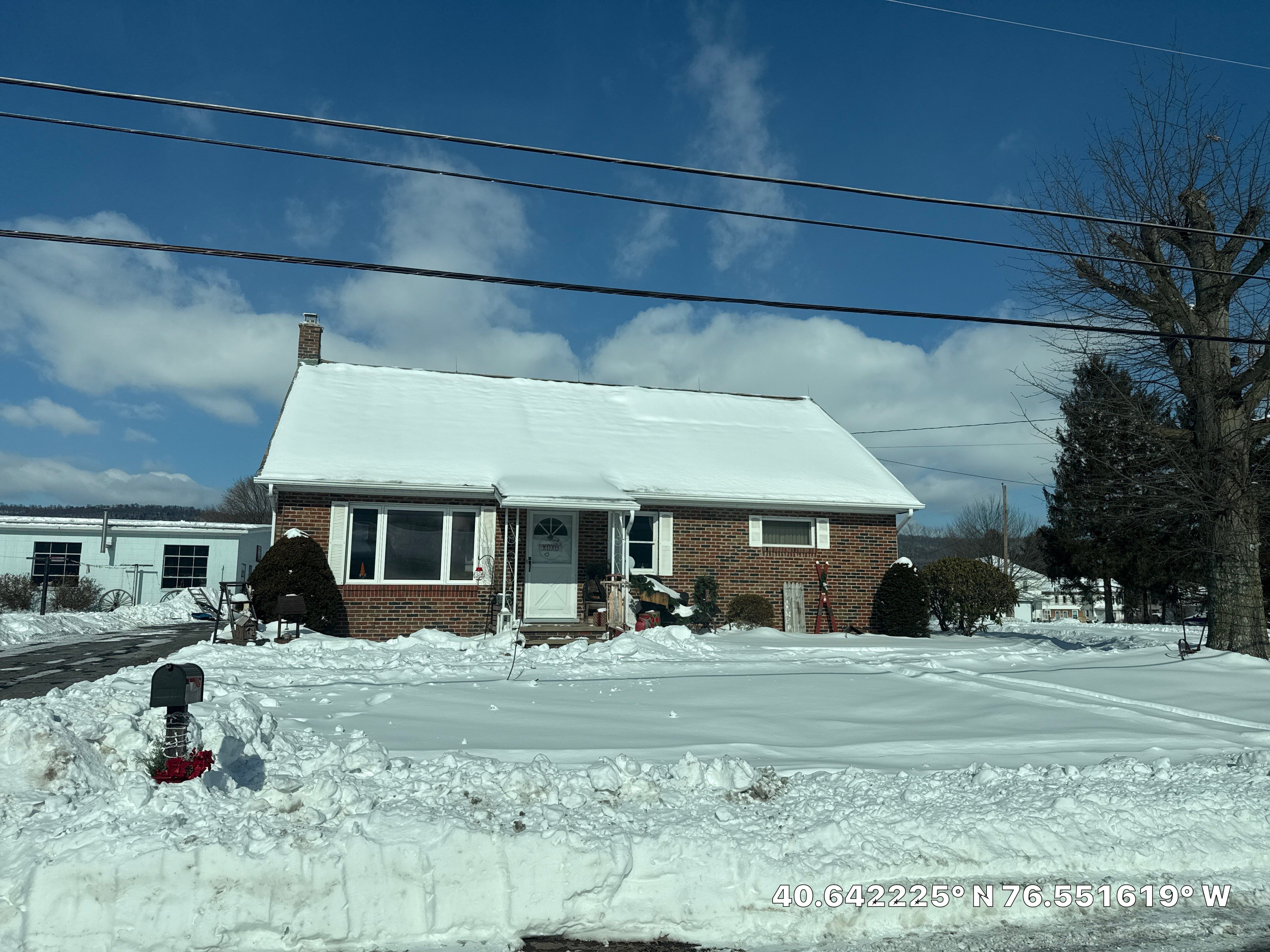 Tan Metal Roof and Gutter Replacement for Valley View Home by Esh Builders
