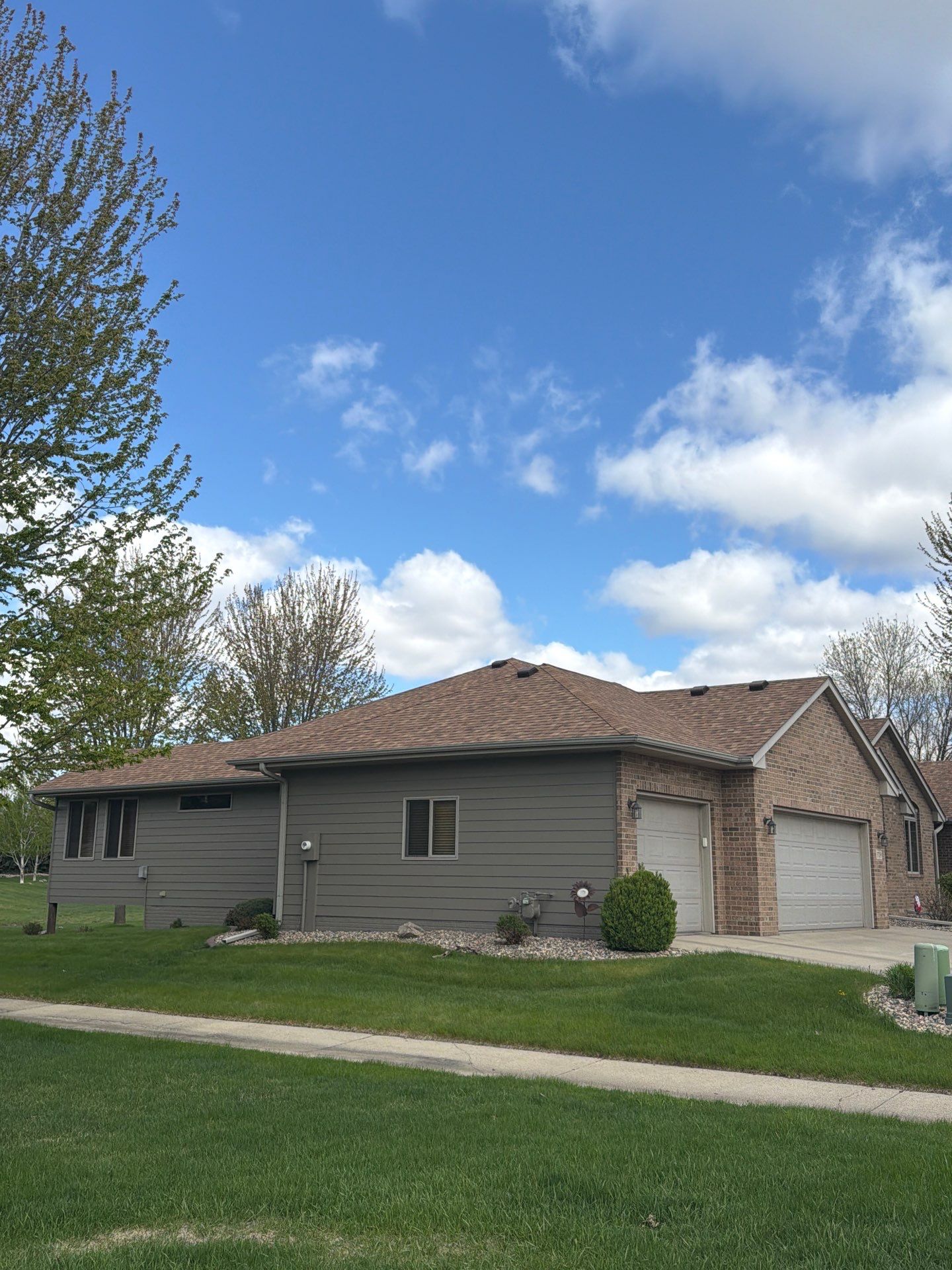 Residential Exterior Siding and Trim Painting in Sioux Falls by Select Painting, Coatings & Garage Cabinets